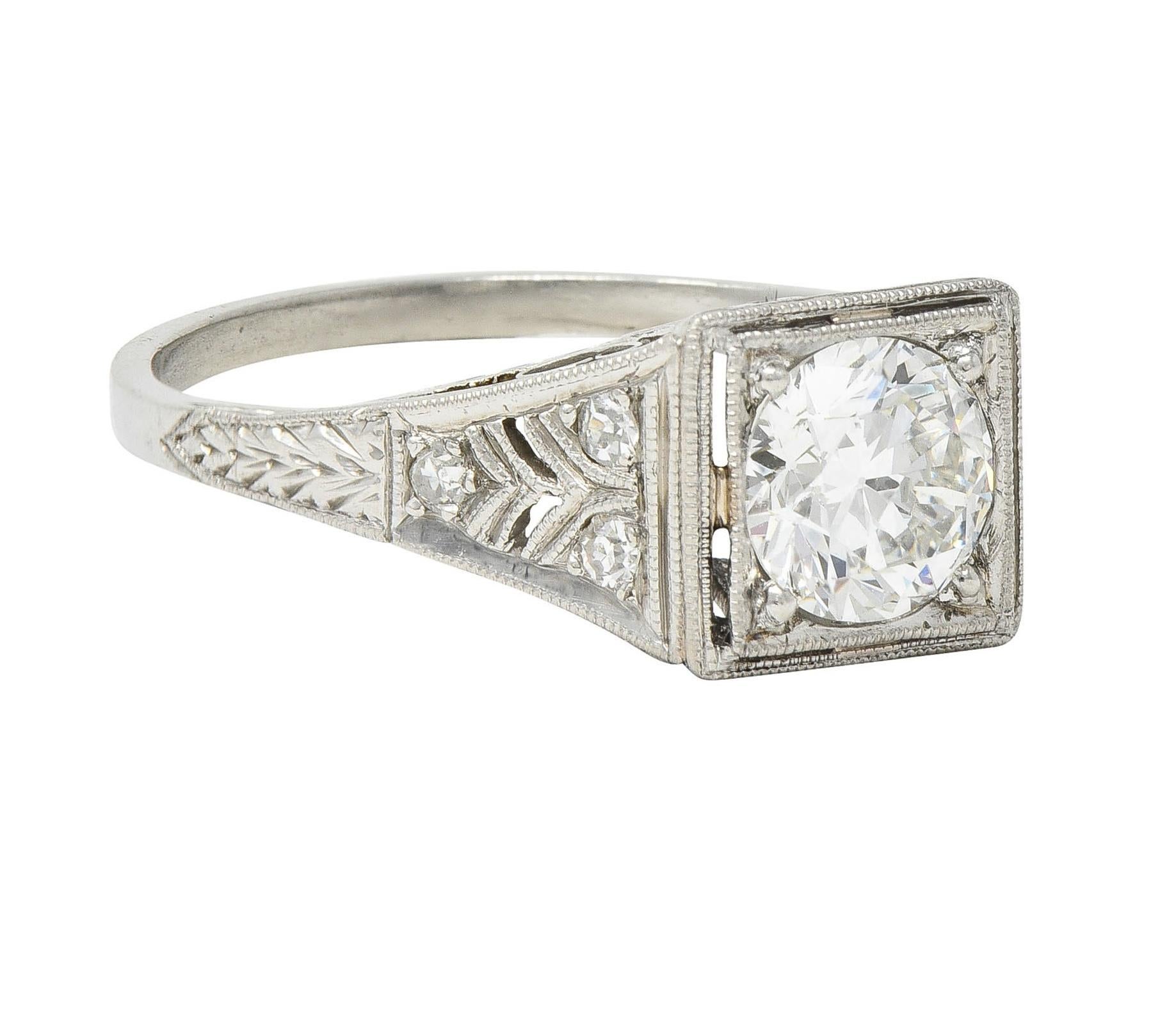 Centering an old European cut diamond weighing in approximately 1.02 carat - I color and VS clarity
Bead set in a square form with a pierced milgrain detail surround 
Featuring a pierced trellis and foliate motif filigree gallery
Flanked by bead set
