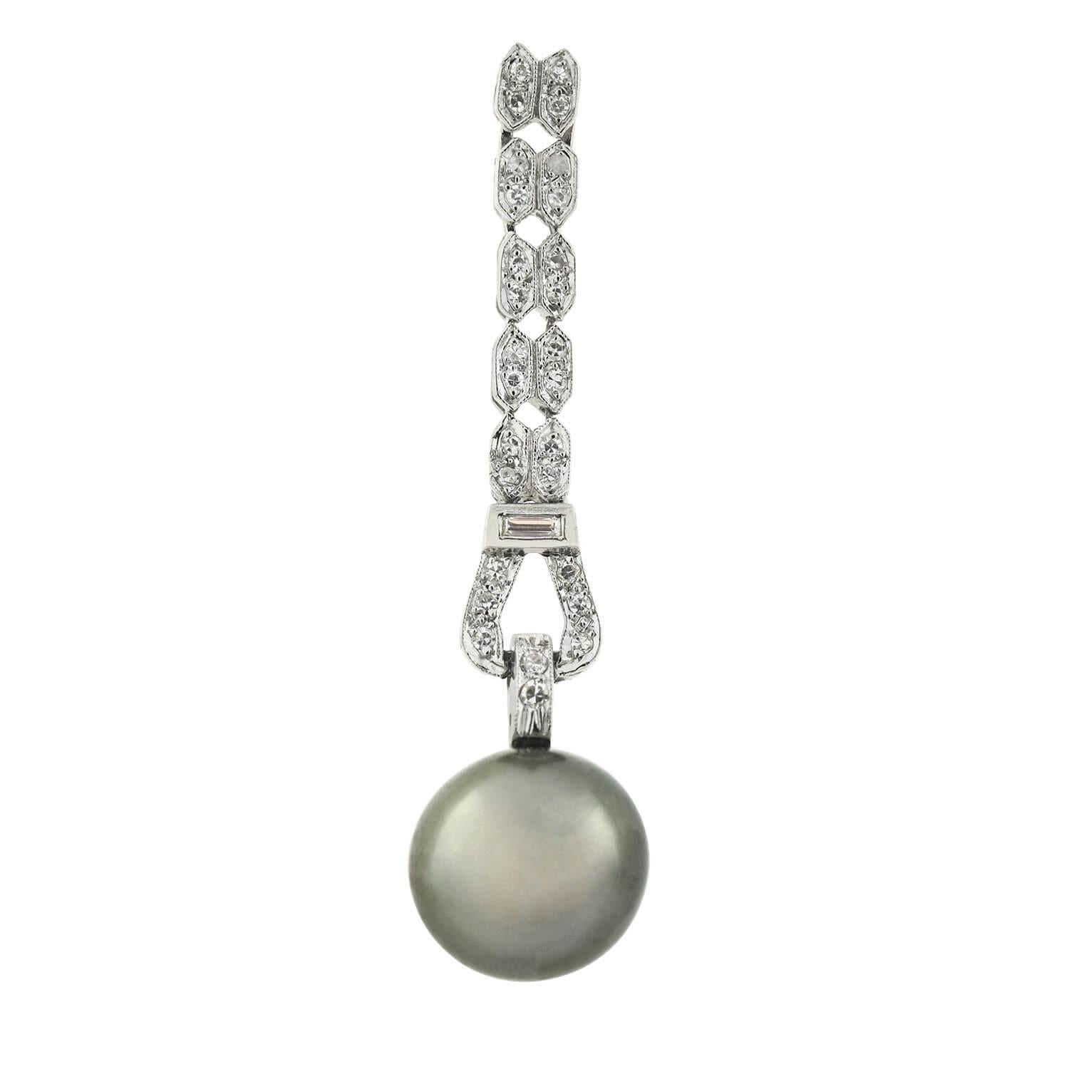 A stunning pair of diamond and black Tahitian pearl earrings from the Art Deco (ca1920s) era! Crafted in platinum, each earring adorns a single Tahitian South Sea pearl dangling at the base of an elegant drop design. The 11mm pearl exhibits a high