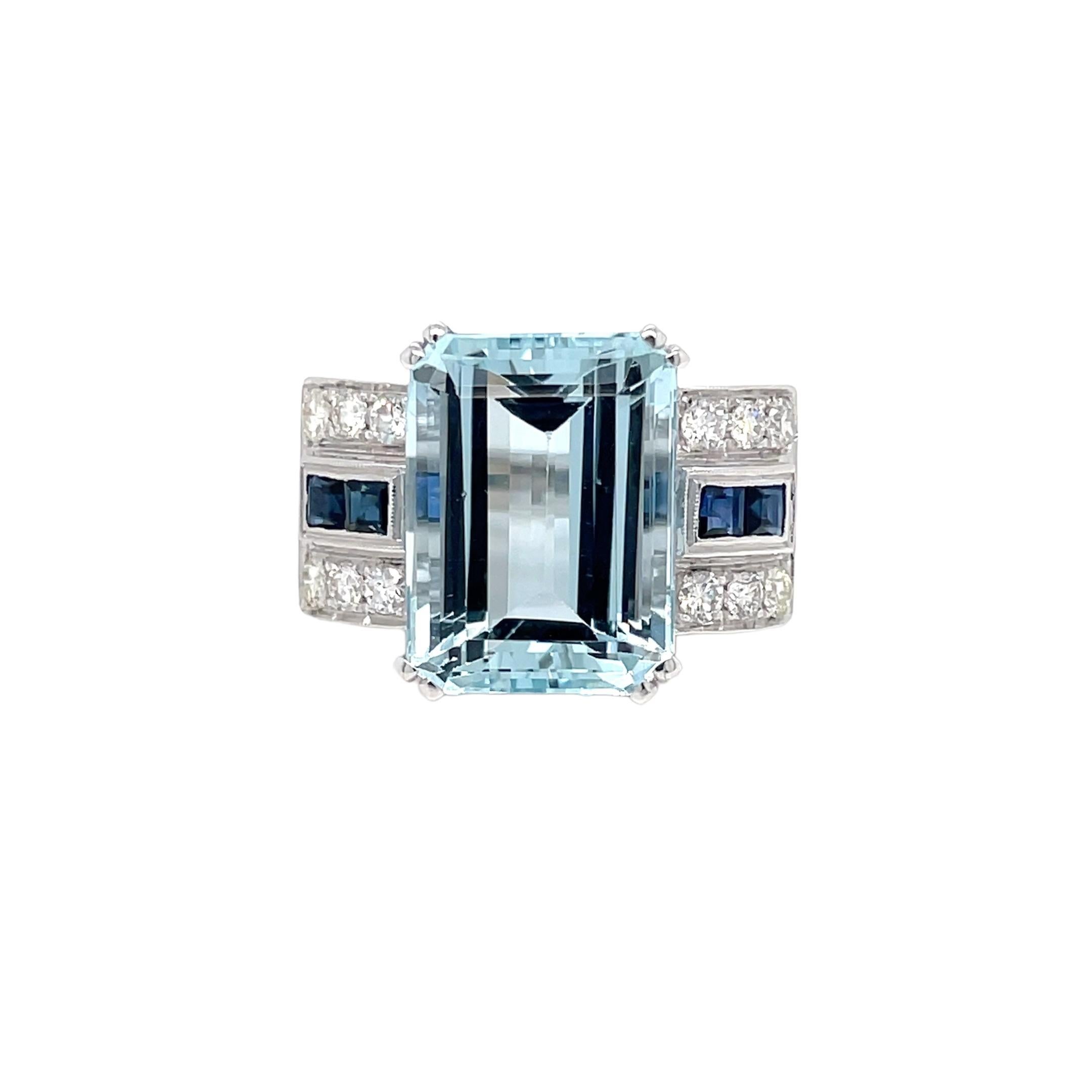Art Deco style ring set in the center with a stunning Aquamarine weighing 11,54 carats graded AAA, and surrounded by approx. 0.50 carat of custom cut Sapphires and 0.65 ct of round brilliant cut diamonds graded G Color Vvs Clarity, Remarkable