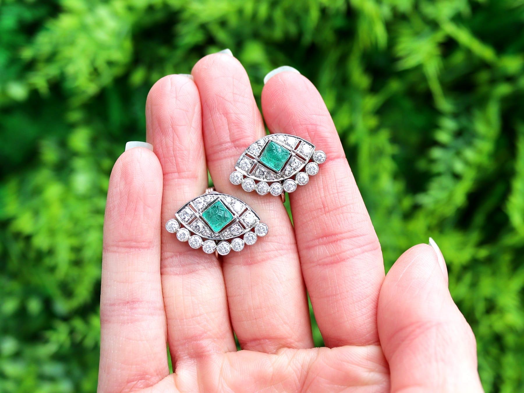 A stunning, fine and impressive pair of antique Art Deco 1.24 carat emerald and 1.66 carat diamond and platinum clip on earrings; an addition to our diverse antique Art Deco jewelry collections.

These stunning, fine and impressive antique emerald