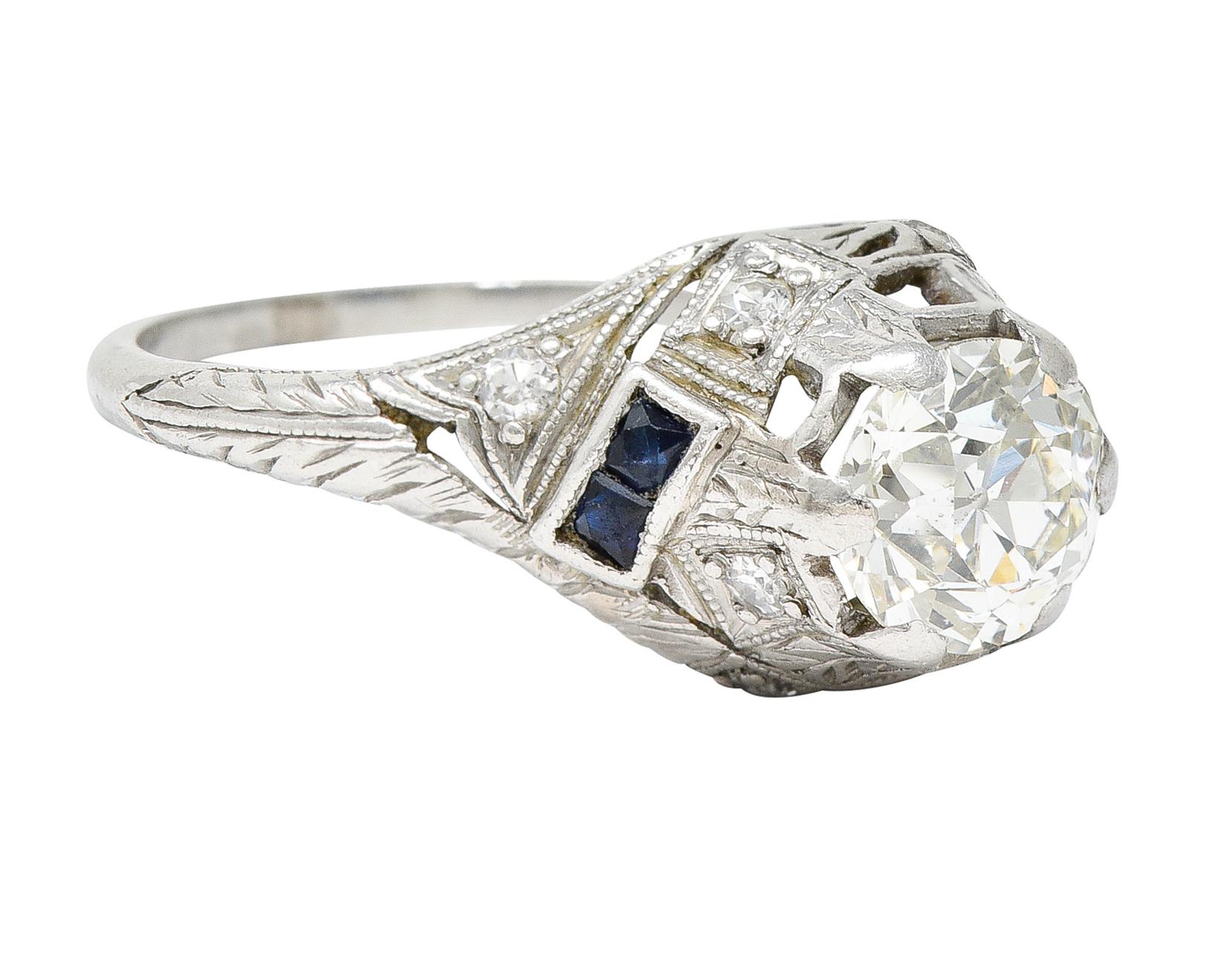 Featuring an old European cut diamond weighing approximately 1.08 carats - K color with SI1 clarity

Set by wide prongs engraved with foliate to match mounting - with a twisting design

Accented by single cut diamonds weighing collectively