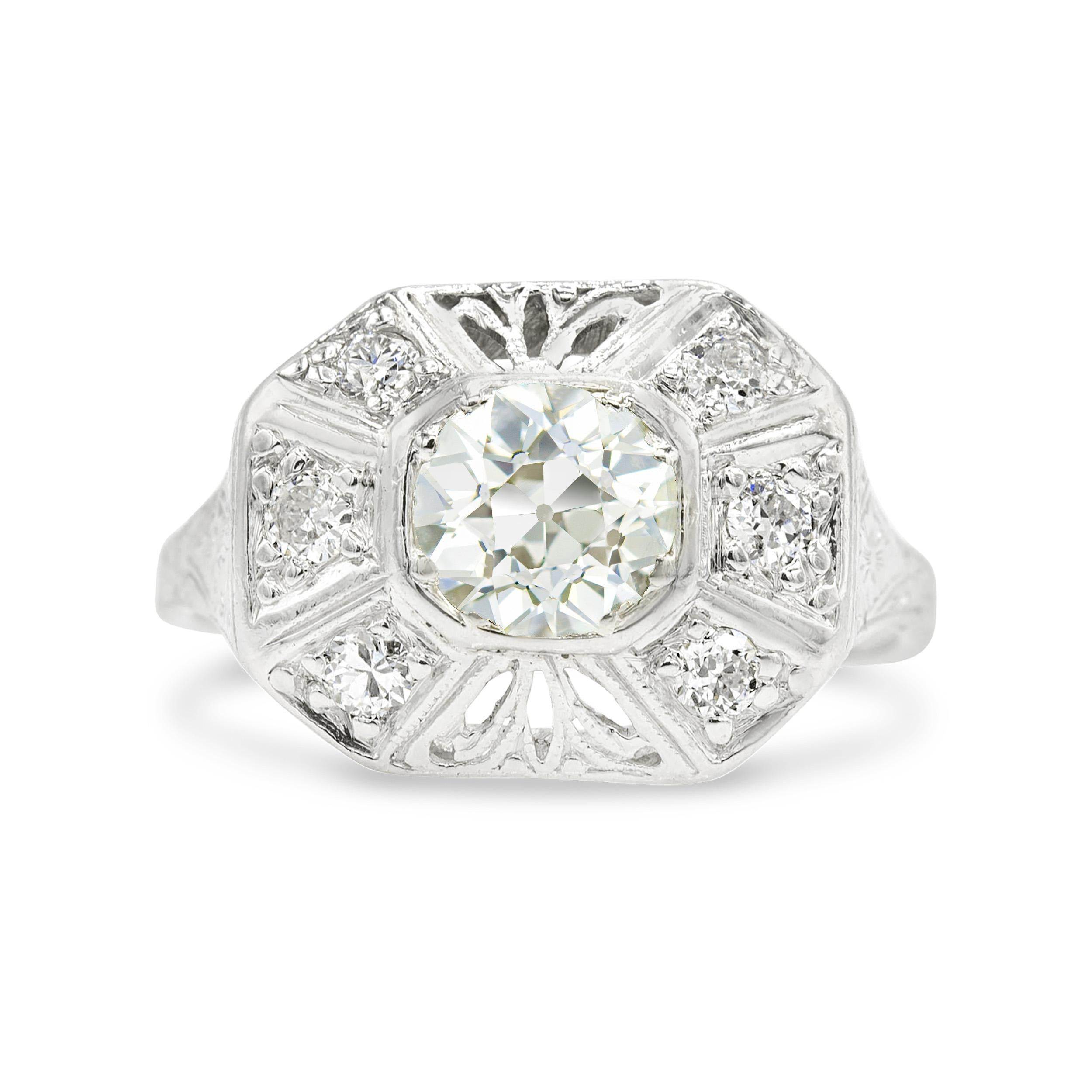 There's something so chic and unconventional about this Art Deco jewel. At the center is a bezel-set and irresistibly charming old mine cut diamond that's accented by 6 additional shimmering stones. Handcrafted in platinum, her geometric frame