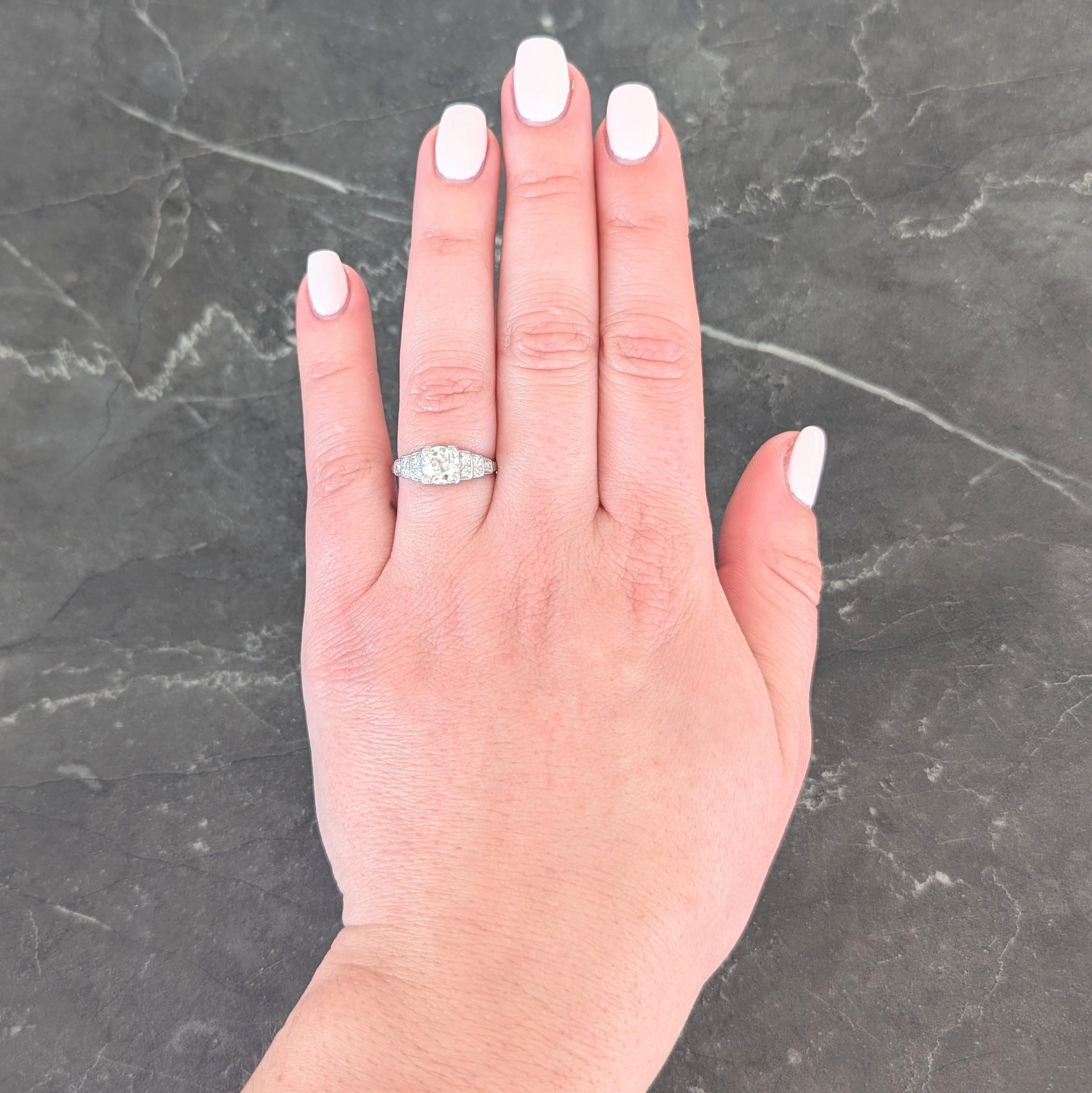 Centering an old European cut diamond weighing approximately 0.99 carat total - L color with VS2 clarity
Bead set in a square form head and flanked by stepped shoulders with single cut diamonds
Bead set and weighing approximately 0.12 carat total -
