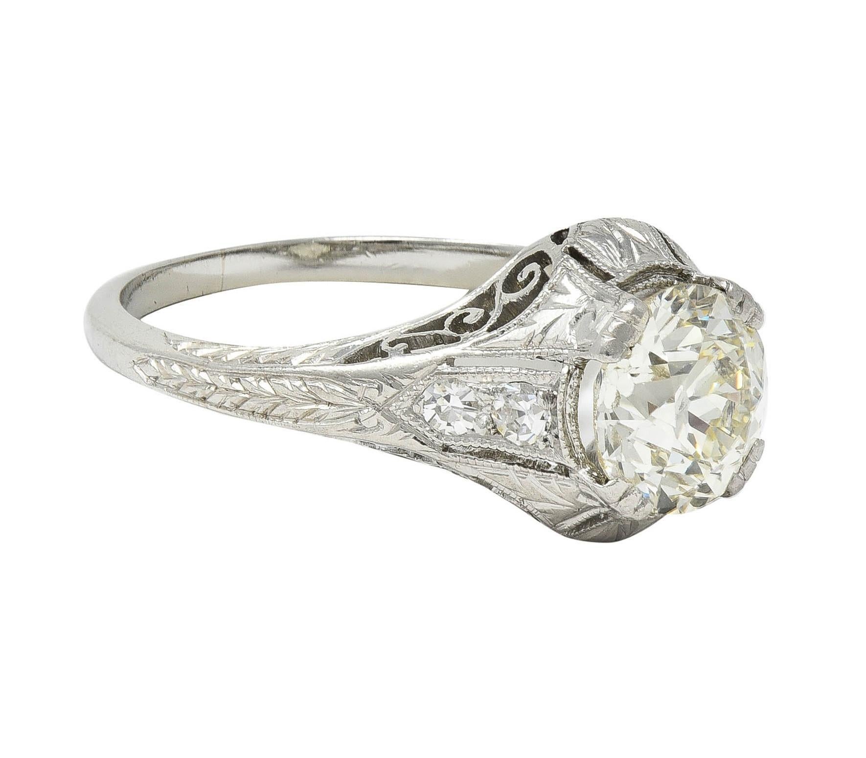 Centering an old European cut diamond weighing approximately 1.22 carats total - M color with VS2 clarity
Set with wide prongs and flanked by single cut diamonds bead set in shoulders
Weighing approximately 0.08 carat total - eye clean and