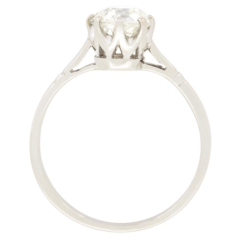 A stunning old cut diamond is showcased in this timeless 1920s solitaire ring. The 1.30 carat old cut central diamond has been graded K in colour and VS1 in clarity. Claw set into an expertly crafted 18 carat white gold mount, the diamond lets in