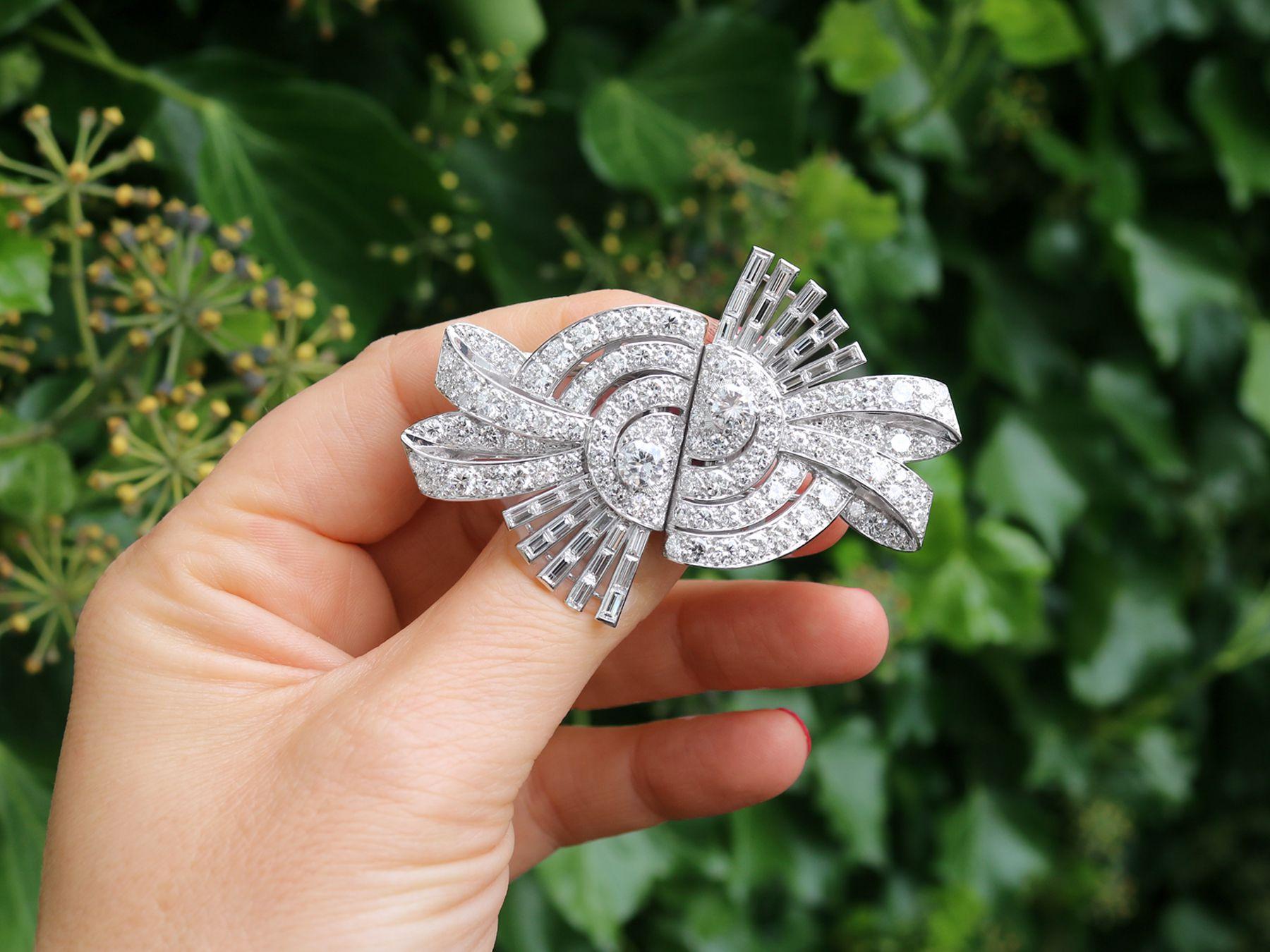 A magnificent, fine and impressive antique 13.22 carat diamond and platinum Art Deco double clip duette brooch; part of our diverse antique jewelry and estate jewelry collections.

This magnificent antique 1930s Art Deco brooch has been crafted in