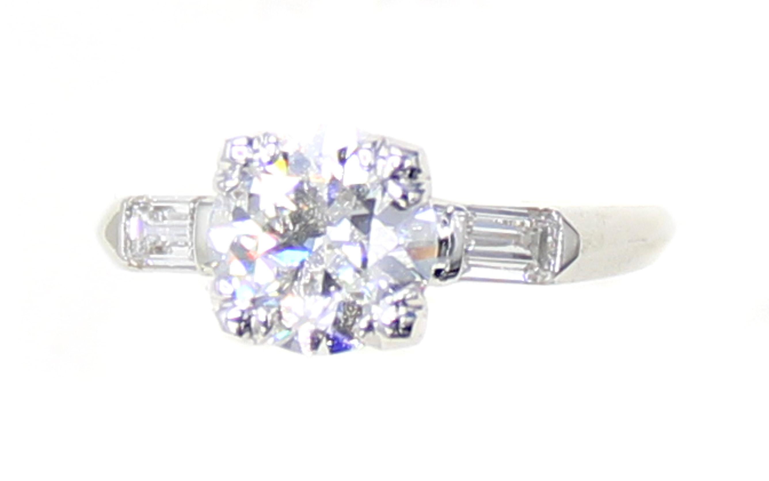 A gorgeous bright white lively Old European Cut diamond is the centerpiece of this platinum baguette diamond handmade engagement ring. Weighing 1.33 carats and accompanied by a report from the GIA giving it a color grade of I and a clarity grade of