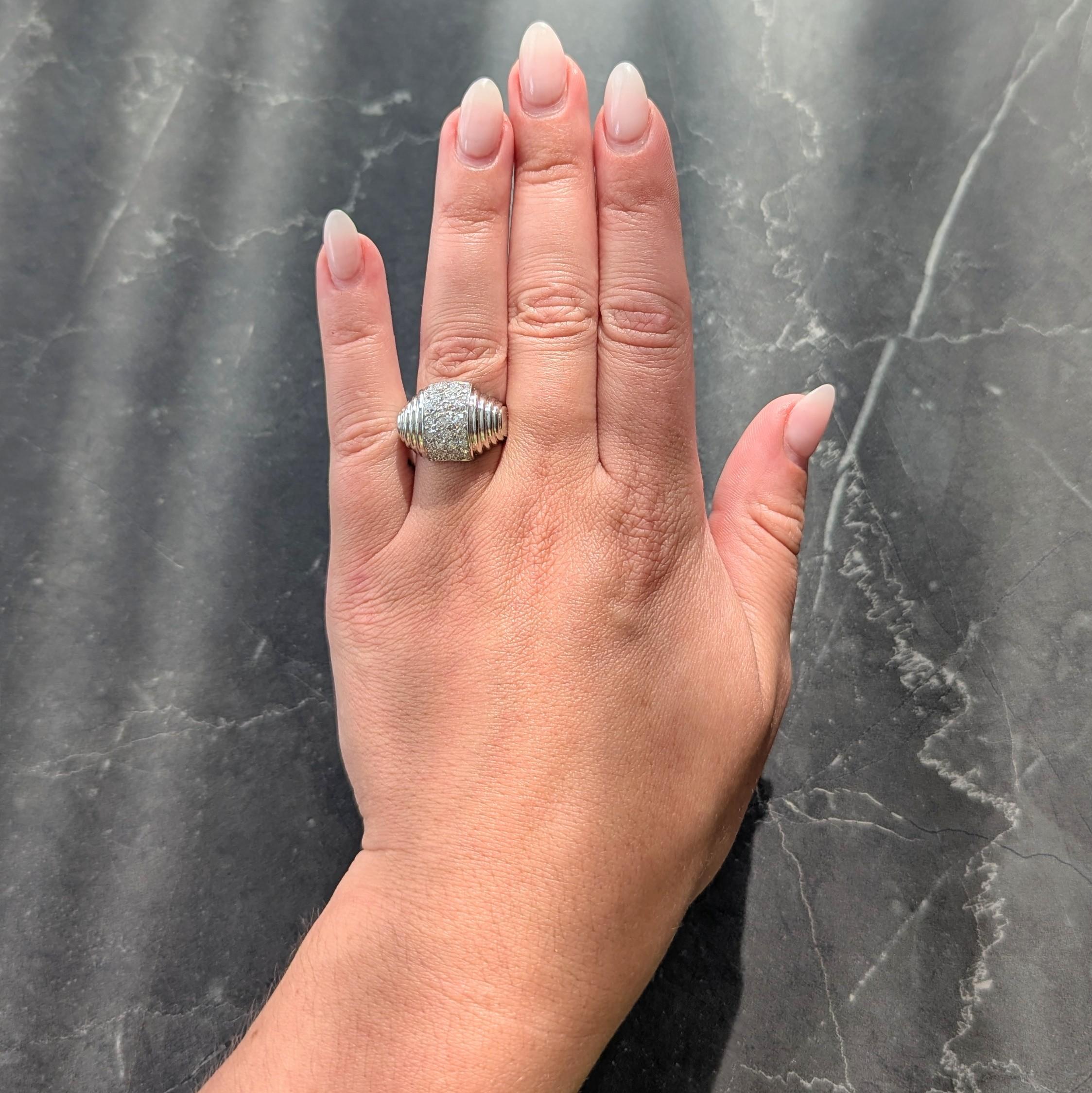 Designed as a domed form pavé set with single and old European cut diamonds
Weighing approximately 1.36 carats total - G to I color with VS2 to SI2 clarity
Flanked by fluted stepped shoulders
Completed by high polish finish
Tested as platinum
Circa: