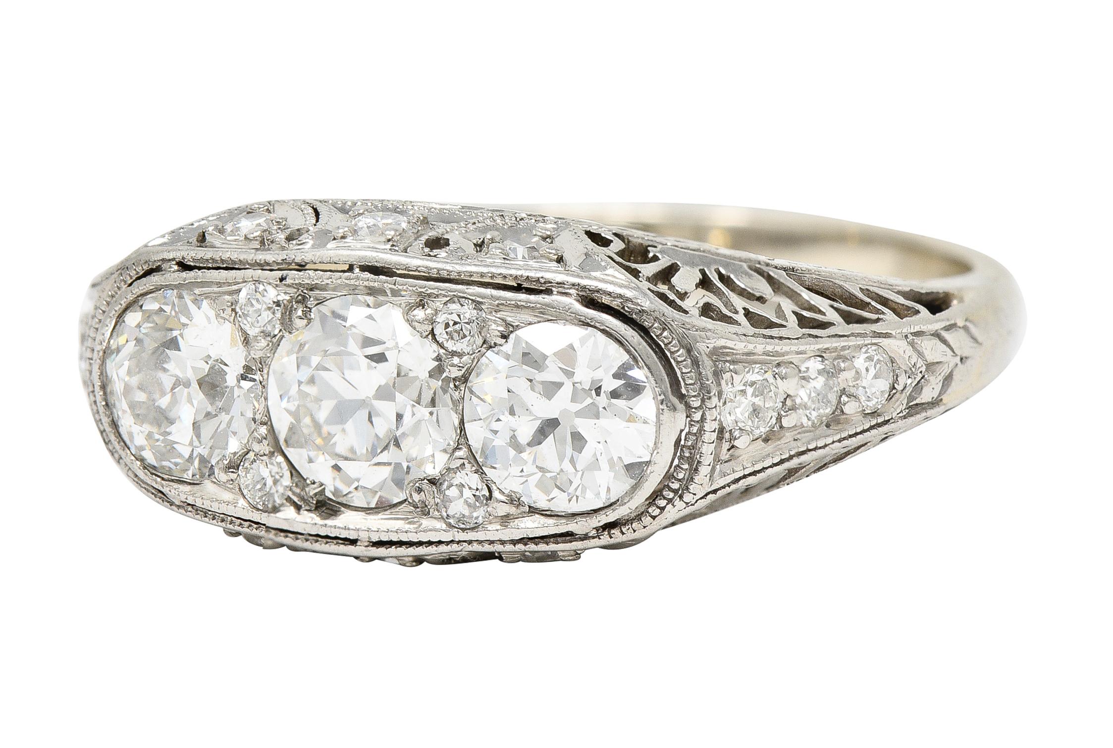 Women's or Men's Art Deco 1.38 CTW Diamond Platinum Three Stone Foliate Vintage Ring For Sale