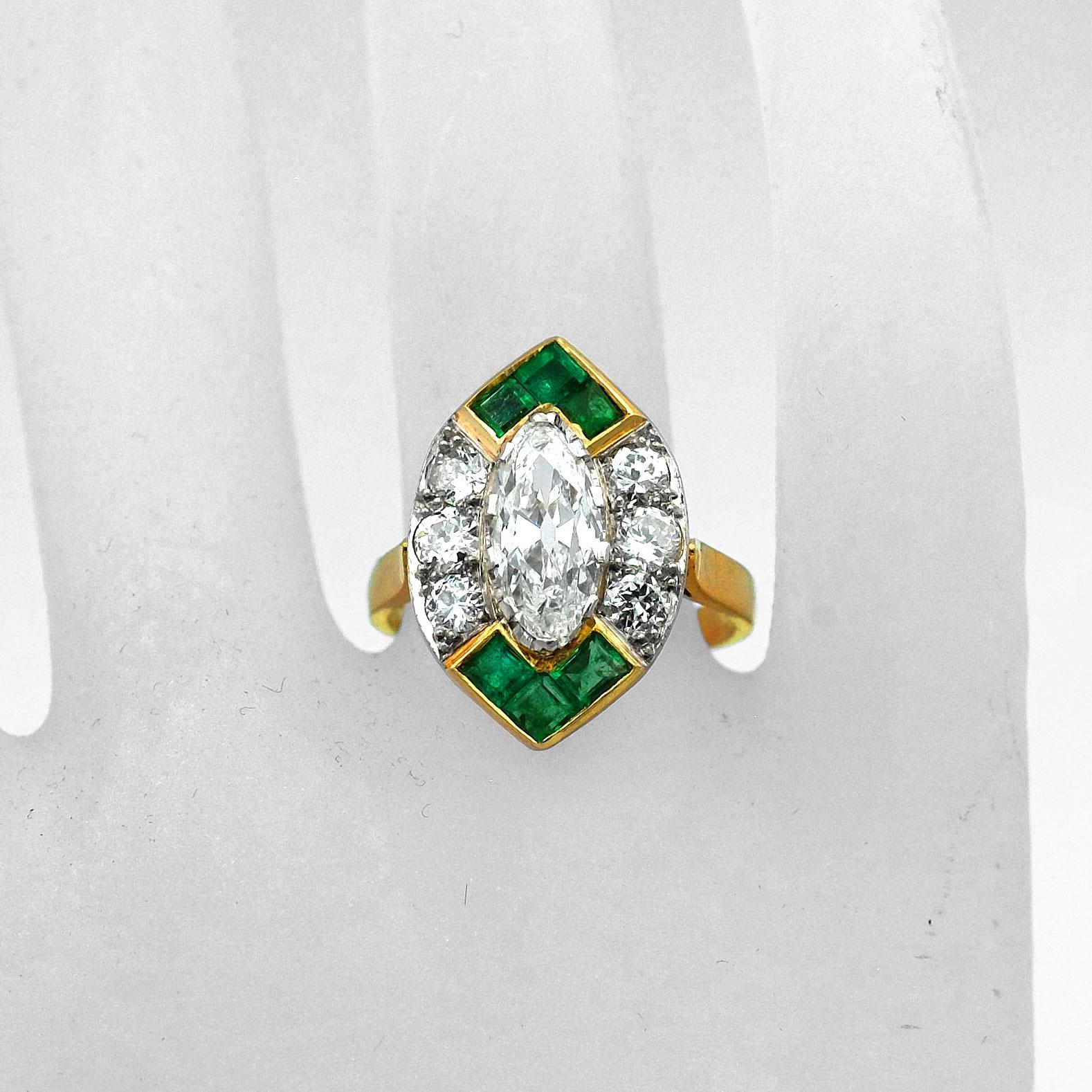Art Deco 1.4 Carat Marquise Cut Diamond and Emerald 18K Gold Ring, circa 1930

Decorative diamond ring with a boat-shaped ring head, set with a radiant old-cut marquise diamond of 1.40 ct in an entourage of square cut emeralds  and 6 diamonds