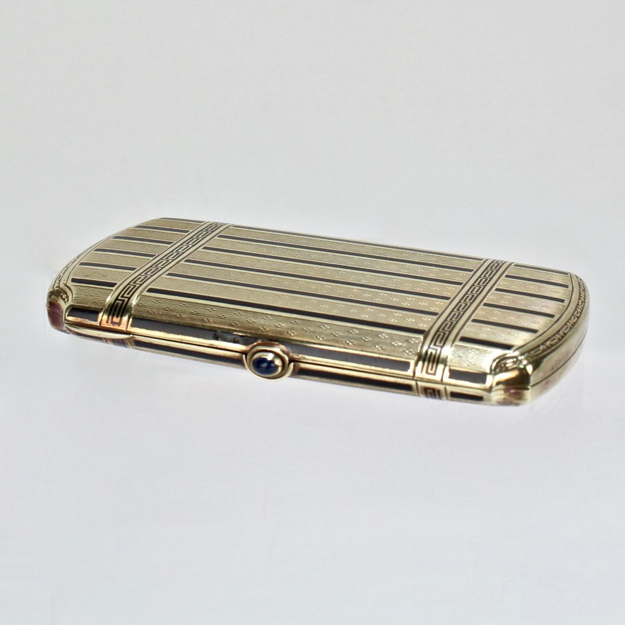 An exceptionally fine Art Deco period lady's 14 karat gold and enamel cigarette case.

Made in America in the early part of the 20th century.

With engine-turned engraving, blue enamel decoration, and a sapphire cabochon push-button clasp.

The