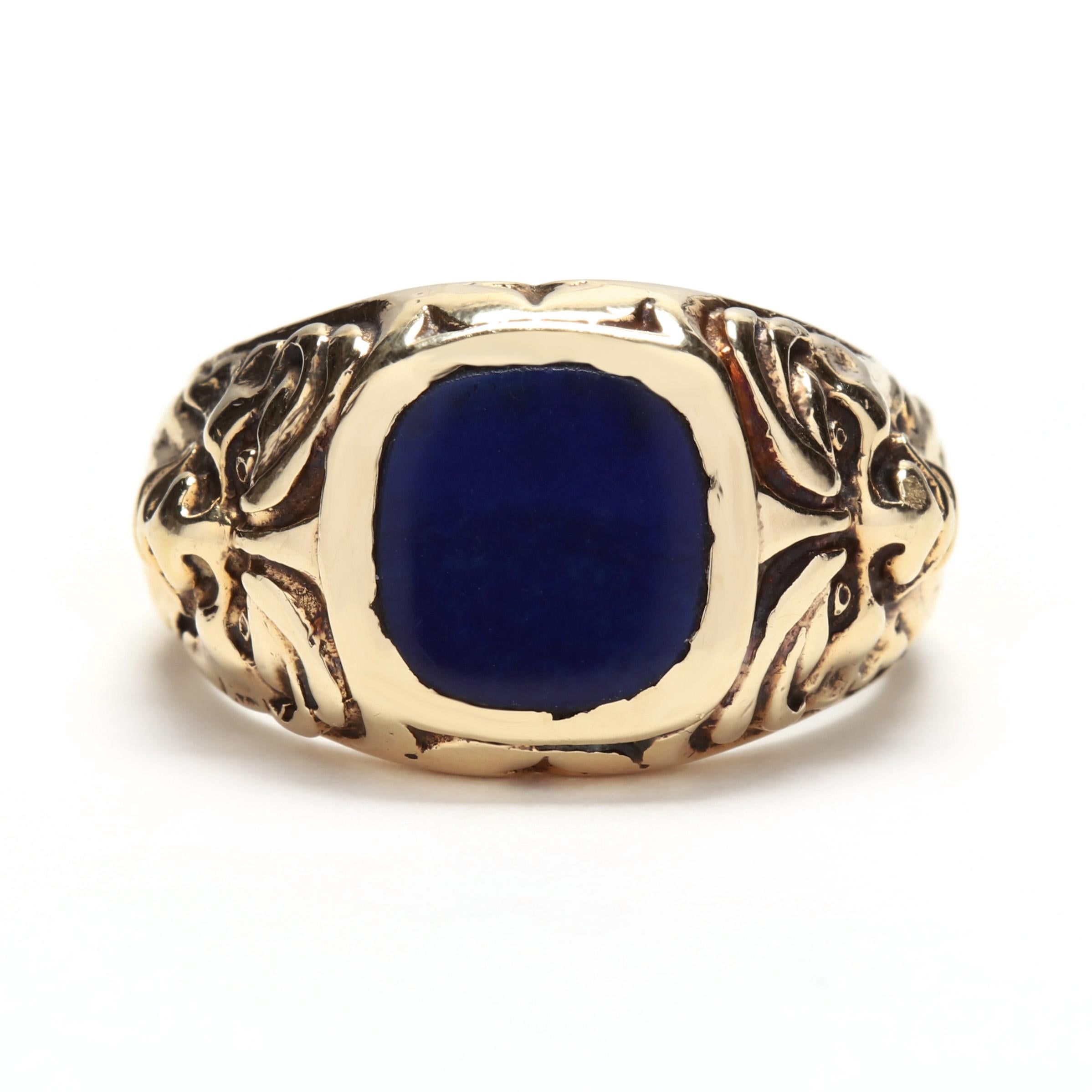 an unusual Art Deco era signet style ring with a flat, cushion cut lapis center stone and hand carved gargoyle faces on the shoulders.

Engraved: Joey I Love You Lisa
Slightly obscured hallmarks
8.13 dwts
Ring Size 8 - sizable