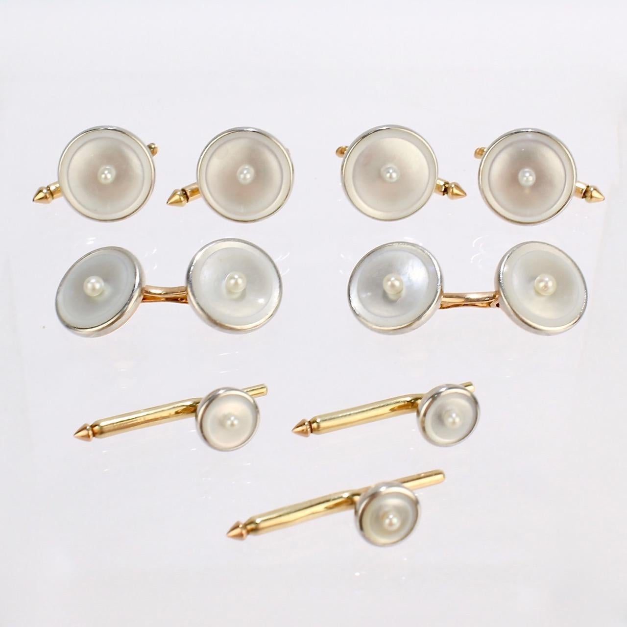 A fine, complete Art Deco 14k gold dress set with mother-of-pearl and seed pearls.

Comprised of a pair of Carrington & Co. cufflinks and collar studs together with 4 associated Larter & Sons vest buttons.

The cufflinks and studs bear the C&C and