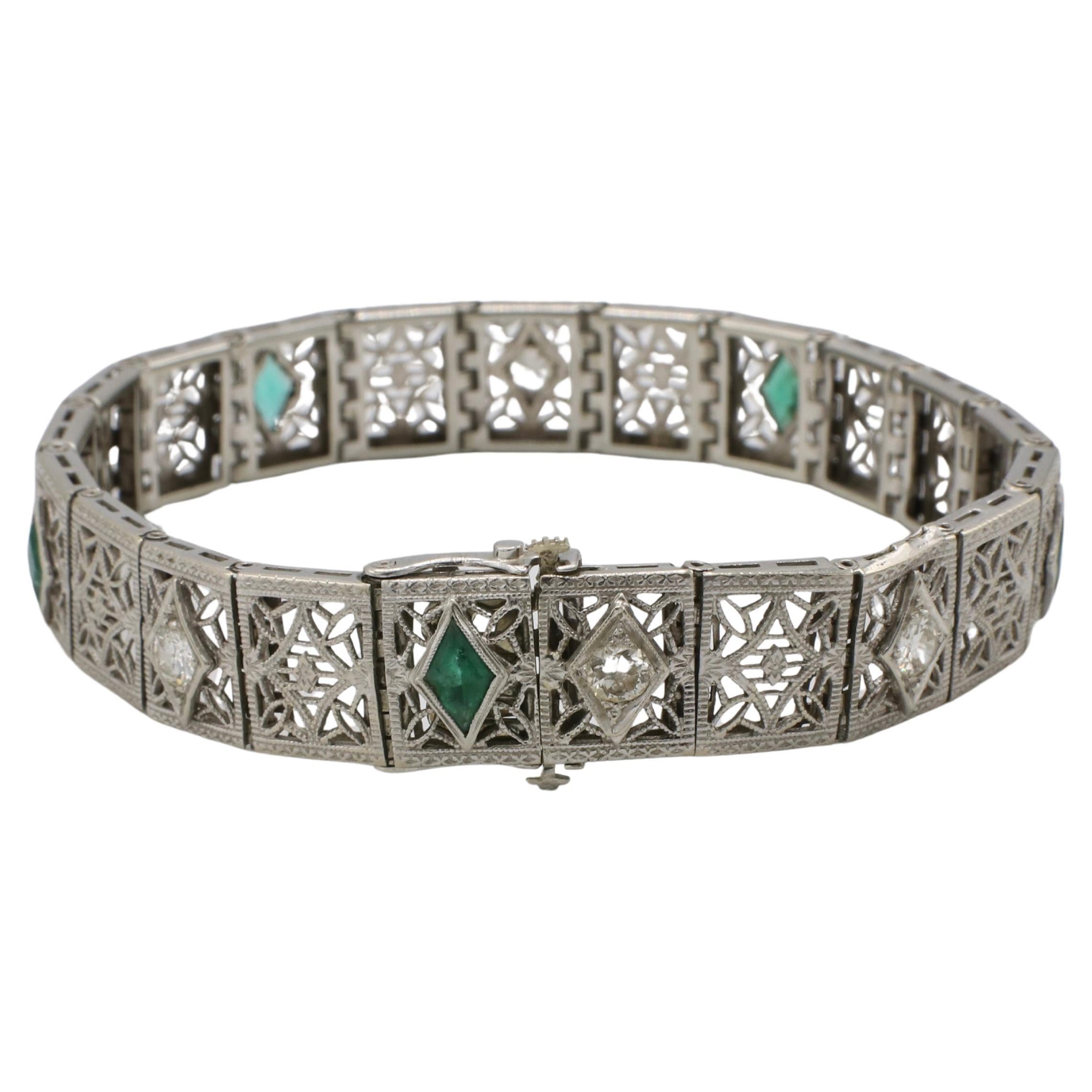 Art Deco 14 Karat White Gold Natural Diamond 
Emerald Filigree Bracelet 
Metal: 14k white gold
Weight: 16.5 grams
Length: 7 inches
Width: 10.5mm
Diamonds: Approx. 1.20 CTW I-J VS natural old European Cut diamonds
KRN F35001494