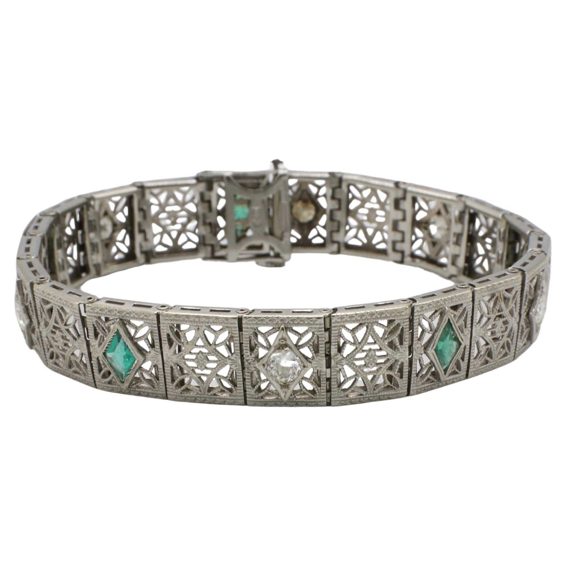Art Deco 14 Karat White Gold Natural Diamond 
Emerald Filigree Bracelet For Sale