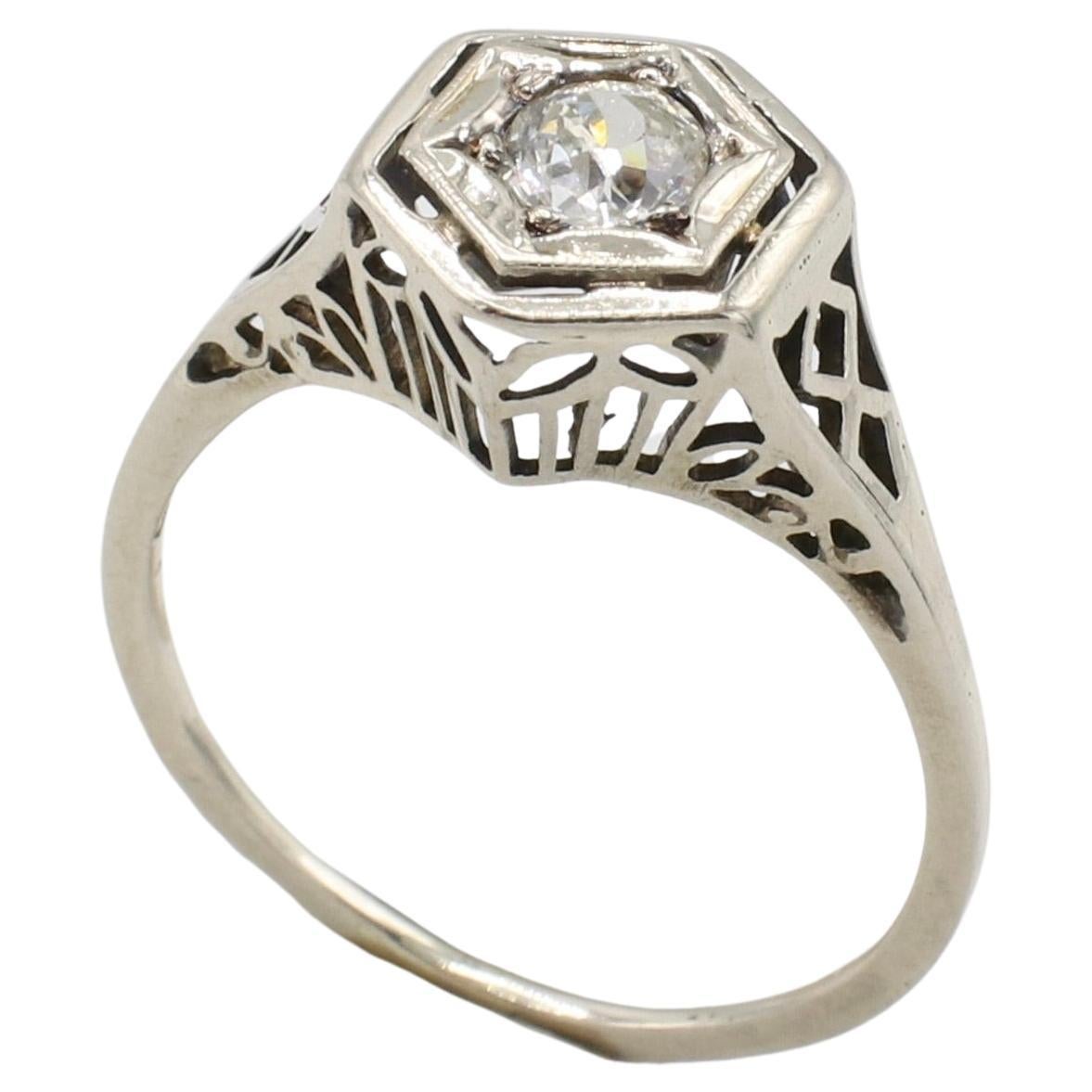 Art Deco 14 Karat White Gold Old Mine Cut Natural Diamond Ring 
Metal: 14k white gold
Weight: 1.70 grams
Diamond: Approx. .30 I VS Old. Mine cut natural diamond
Height: 7mm
Size: 7 (US)
Band width: 1mm 