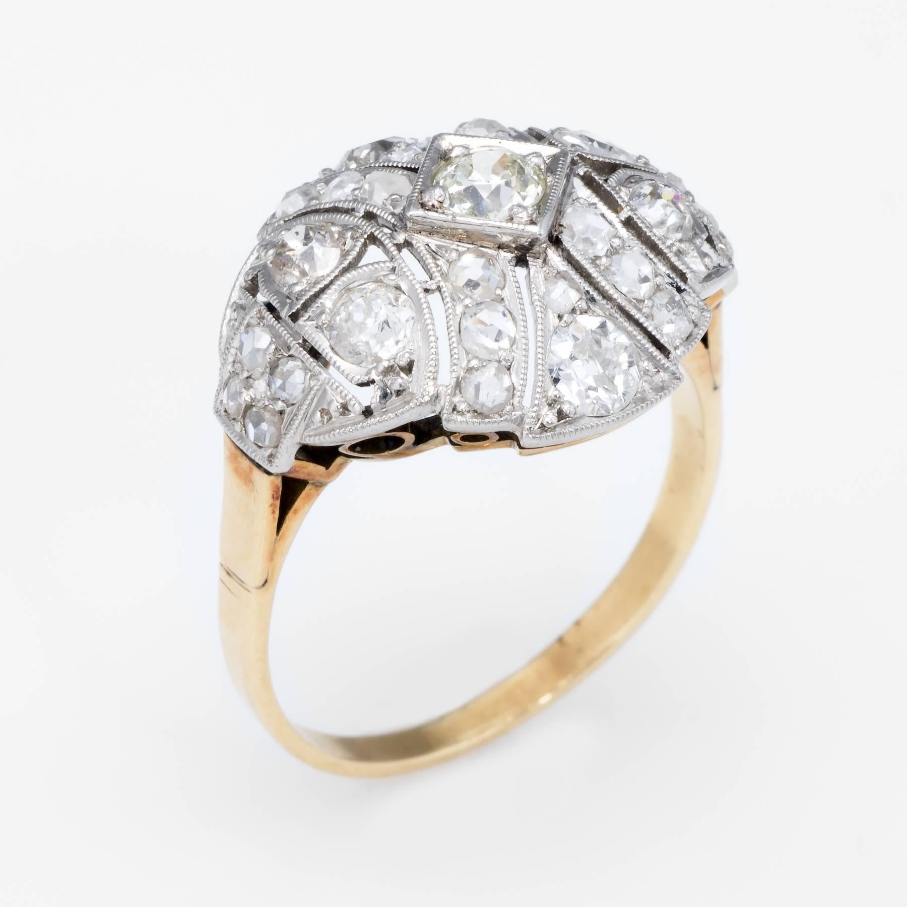 Overview:

Finely detailed vintage Art Deco era ring (circa 1920s to 1930s), crafted in 14 karat yellow & white gold. 

Centrally mounted estimated 0.20 carat old mine cut diamond is accented with rose & mine cut diamonds that range in size from