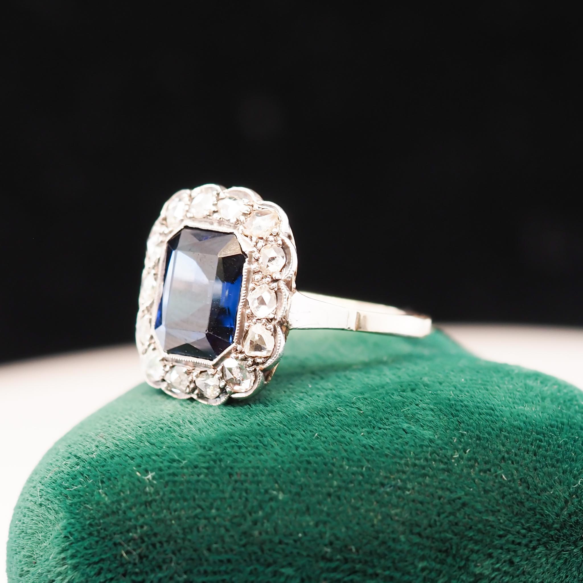 Item Details:
Ring Size: 7.25
Metal Type: 14K Yellow Gold [Hallmarked, and Tested]
Weight: 1.6grams

Diamond Details: Natural Diamonds, Rose Cut, .50ct total weight, G-H Color, VS Clarity

Sapphire Details: Blue, Synthetic, 10mm x 8mm, Radiant