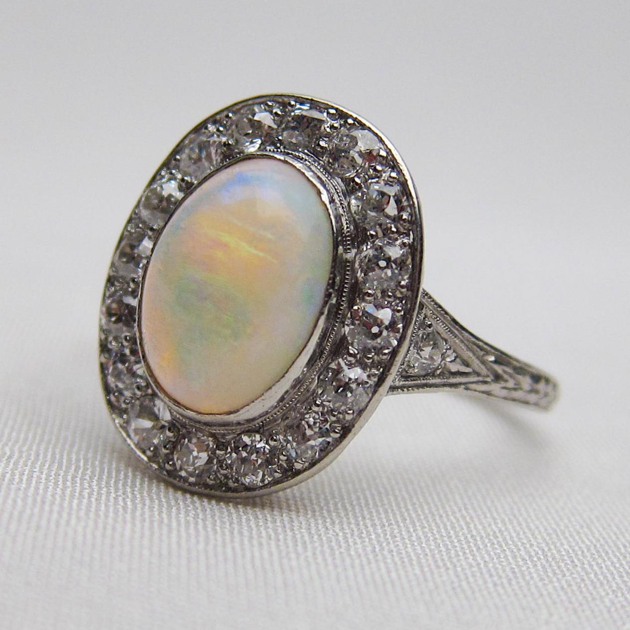 Women's Art Deco 1.40 Carat Cabochon-Cut Opal and Diamond Halo Platinum Ring For Sale