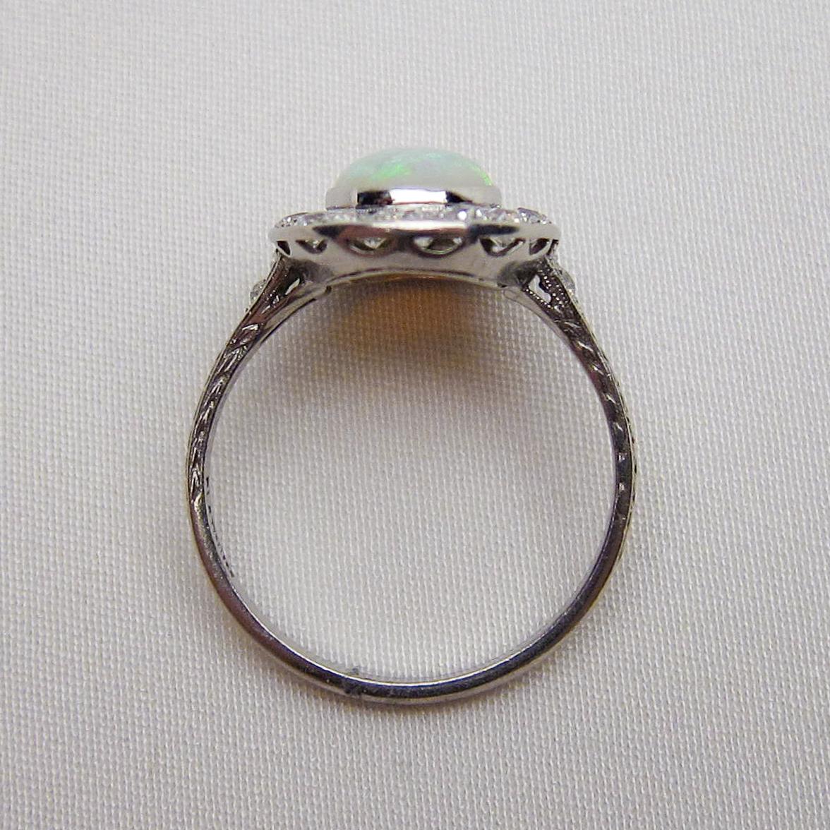 Art Deco 1.40 Carat Cabochon-Cut Opal and Diamond Halo Platinum Ring For Sale 2