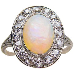 Art Deco 1.40 Carat Cabochon-Cut Opal and Diamond Halo Platinum Ring