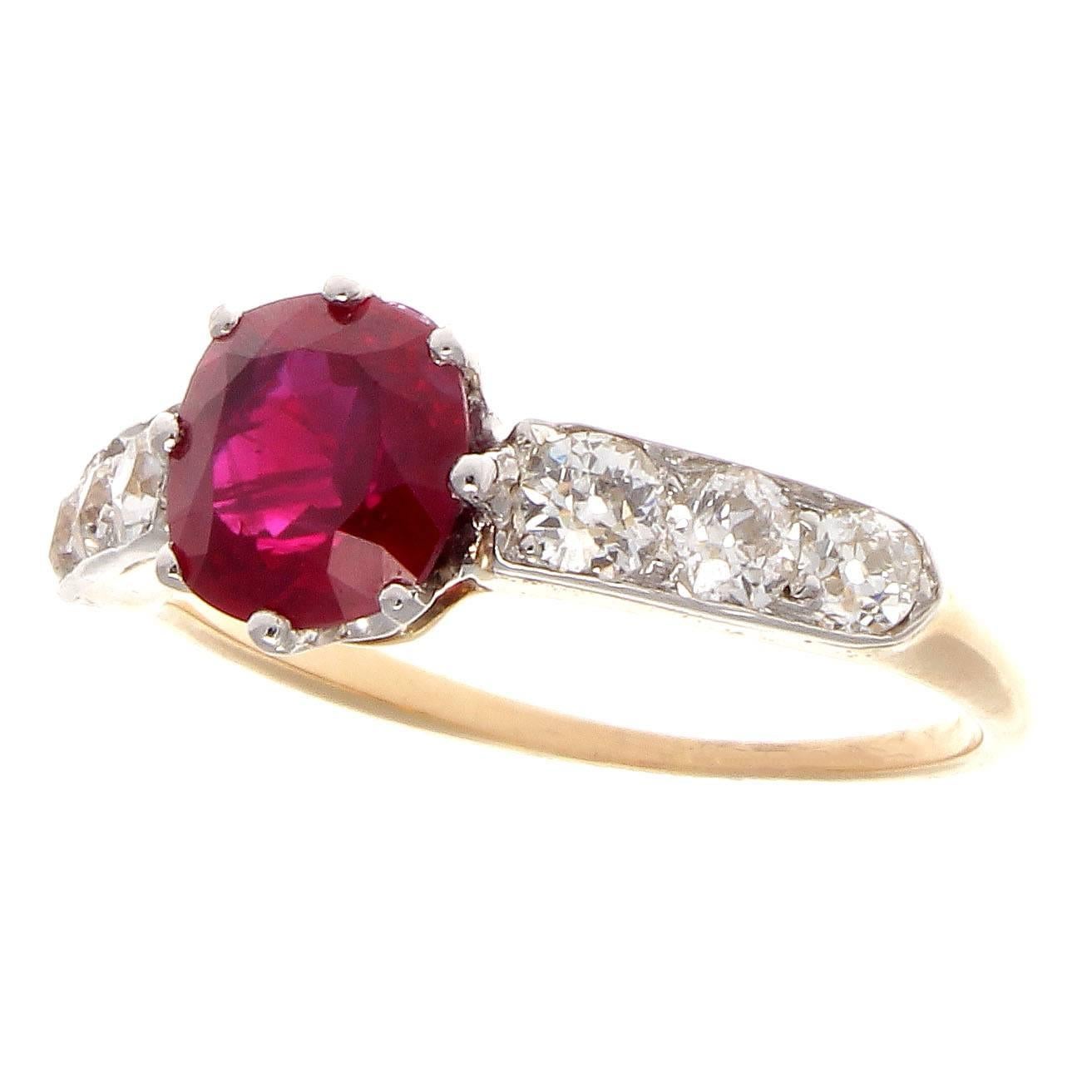 GIA certified 1.44 carat Burma heated ruby
accented by approximately 0.50 carats of old European cut diamonds F-G color, VS clarity.
Crafted in 18k yellow gold and platinum.

Ring size 6 and may easily be resized to fit.