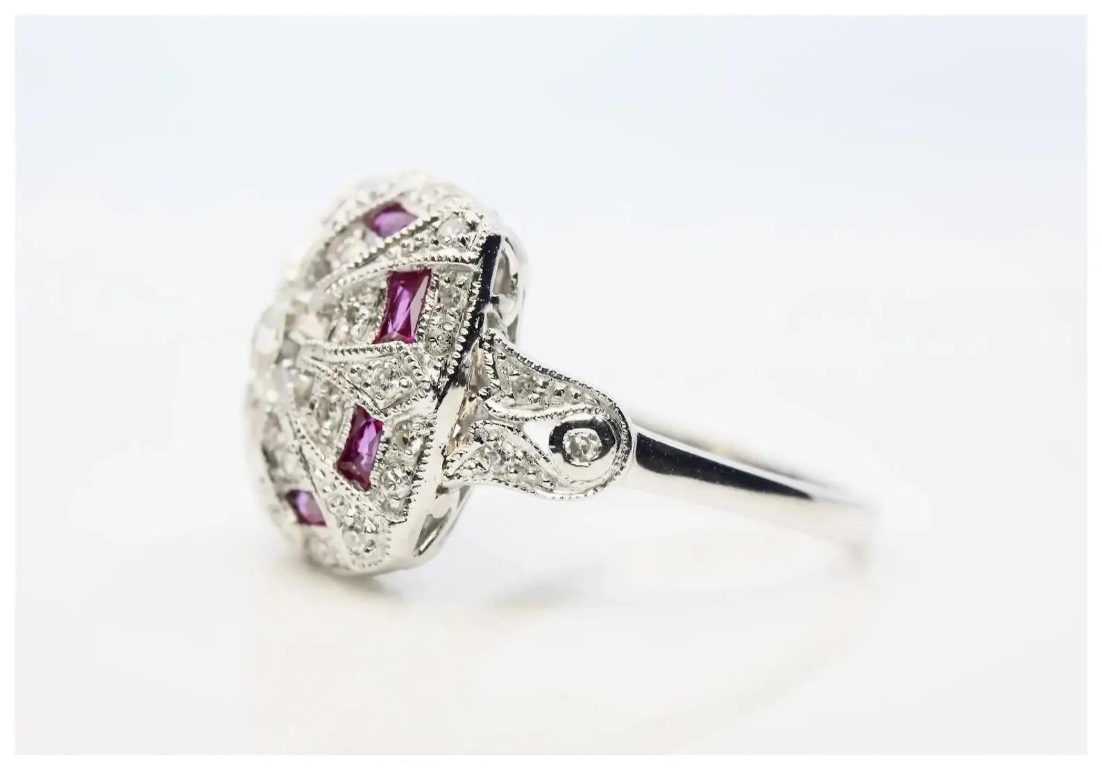 A beautiful Art Deco style diamond and French cut ruby ring in platinum.

Centered by a 0.60 carat old European cut diamond of VS2 clarity and J color.

Accented by eight French cut rubies of 0.48ctw with beautiful vivid red color.

Pave set
