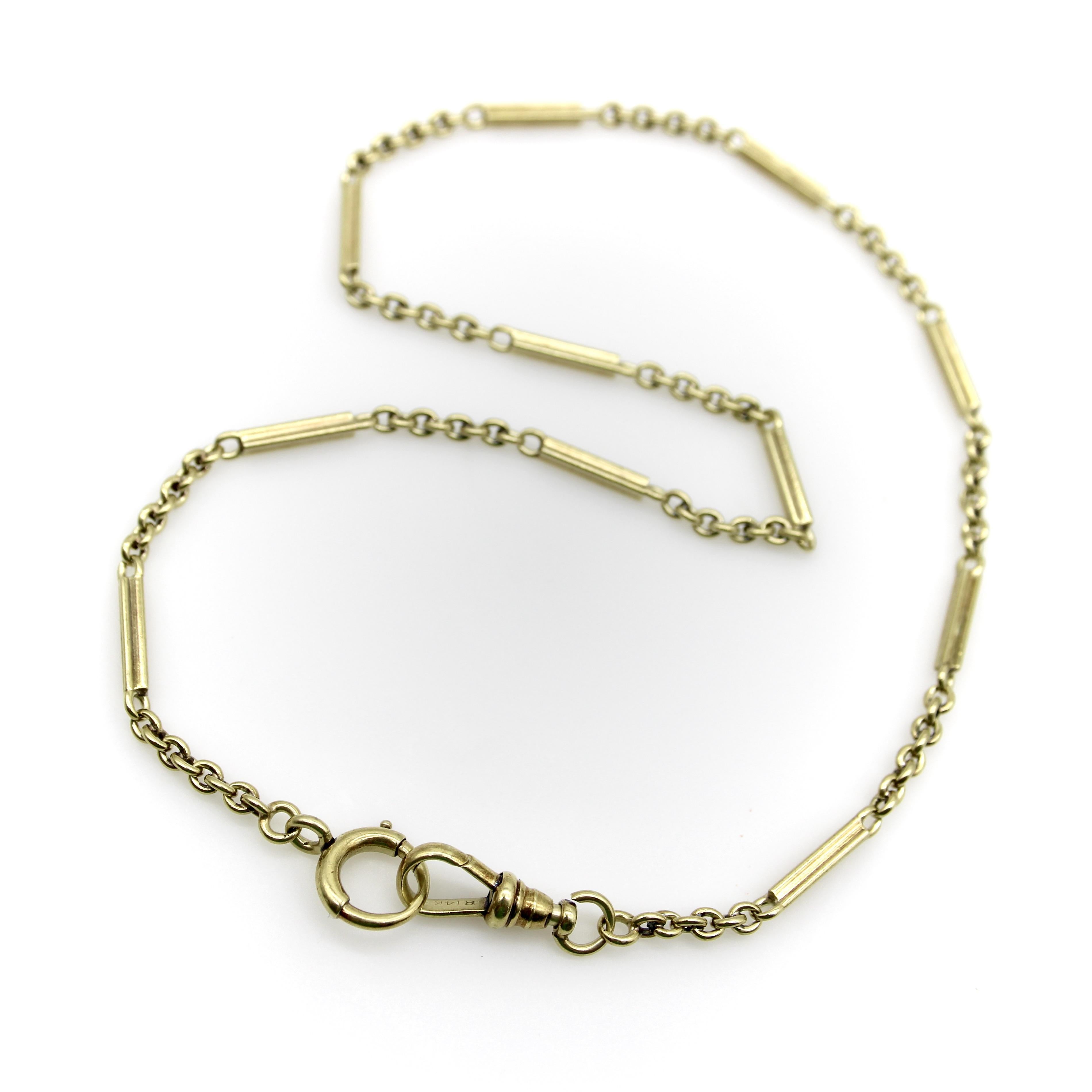 This 14k gold Art Deco chain consists of a link that alternates between a bar and five links, creating a great rhythmic chain. It has a weight of 17.2 grams, giving it a nice presence on the neck. The chain has a dog clip on one end and spring ring