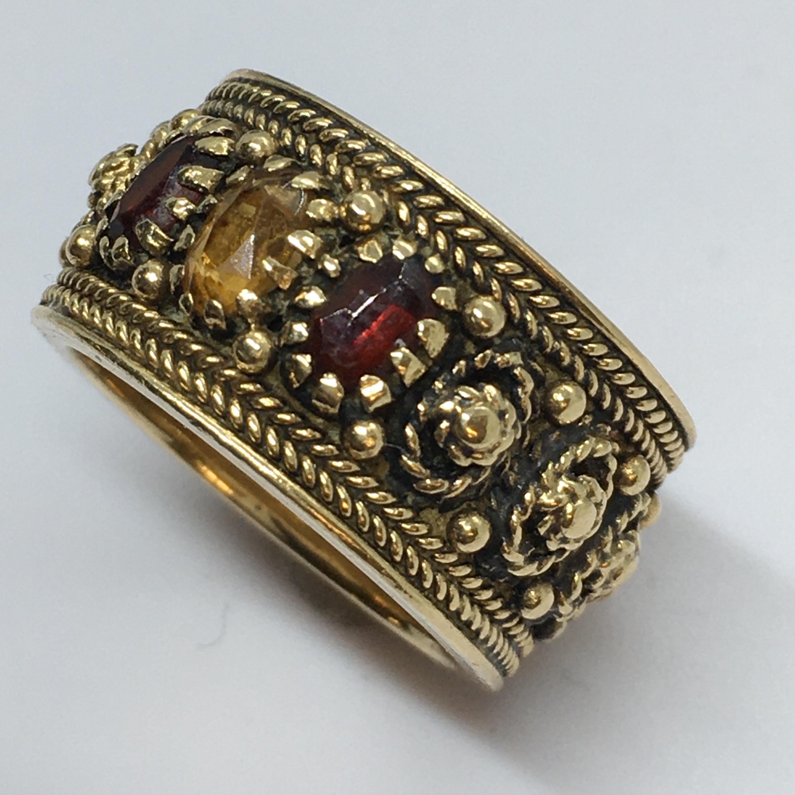 Art Deco 14K gold band Garnet Citrine extensive bead work 

8.7 gram
Size 5.75
11mm or 1/4 inch wide
3mm by 5mm stones 
No damage, no evidence of repairs, see pictures 