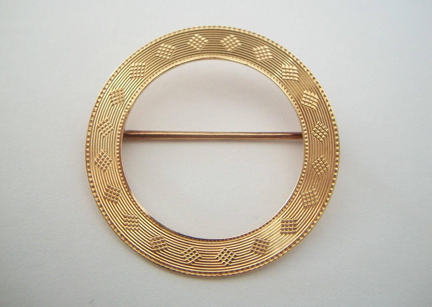 Art Deco 14K yellow gold engine turned circle brooch - refined and elegant - fine quality - early hand made catch with safety latch - hand made hinge and pin - marked 14K on the catch - old auction house inventory number etched to back - unsigned -