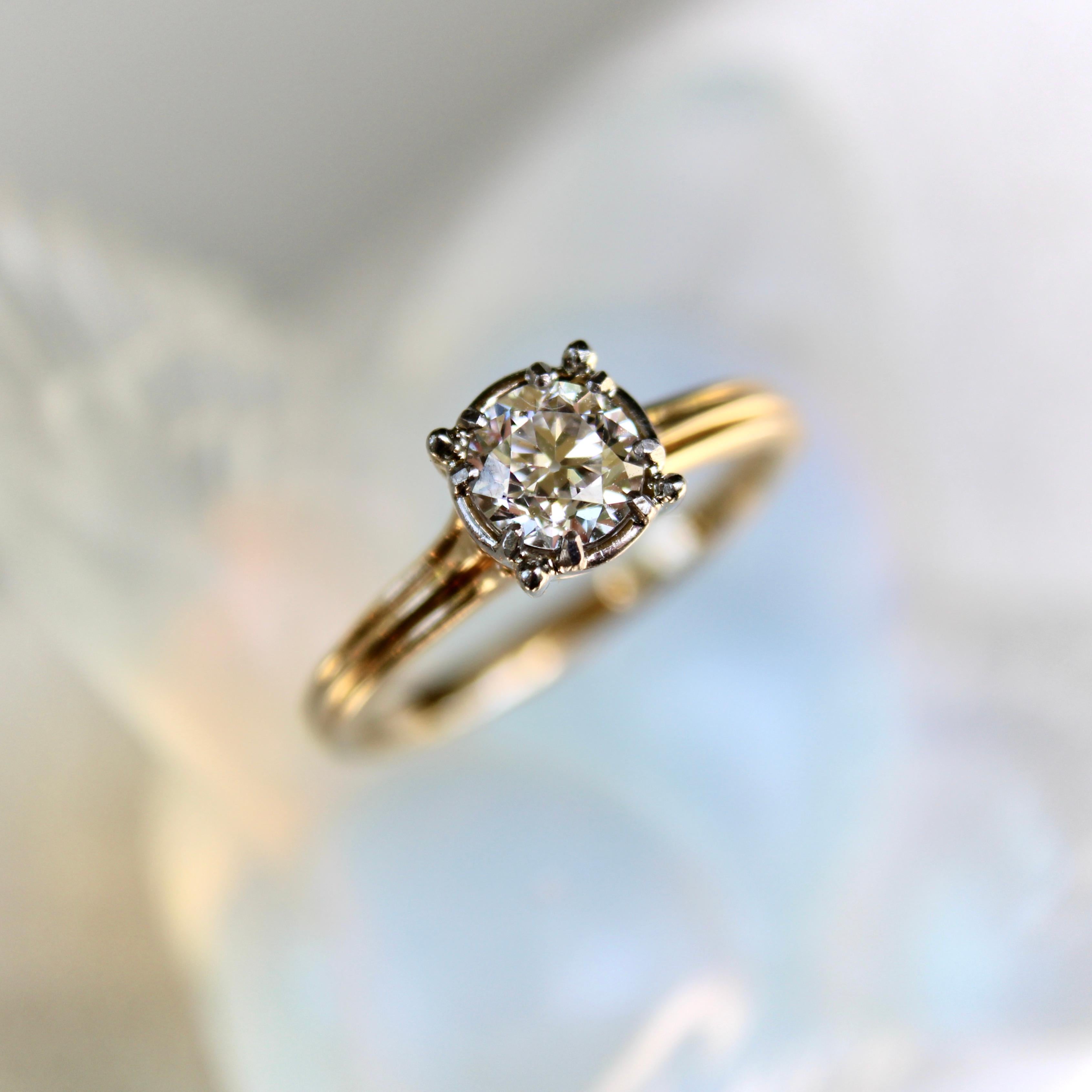 This beautiful 14k gold Jabel engagement ring contains a stunning half-carat Old Mine Cut diamond. The stone is prong set in a 14k white gold carriage with an illusion setting that encircles the diamond and visually enhances the size of the stone.