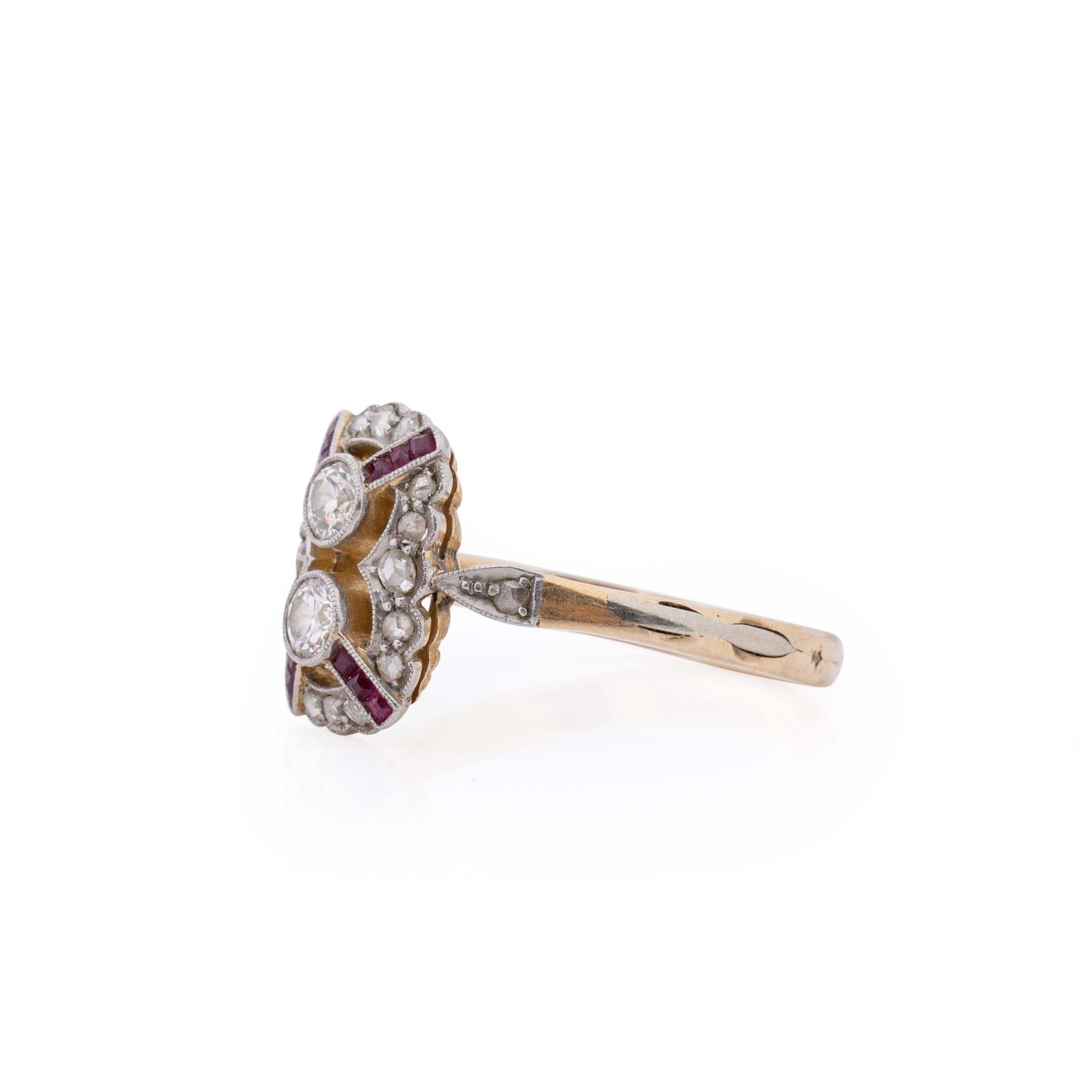 A piece worthy of royalty. Here we have a small shield ring from the art deco era, the two tone ring is crafted in 14K with beautiful color and detail. The shield its self has fantastic scalloped edges, in the center of the rectangle is vibrant ruby