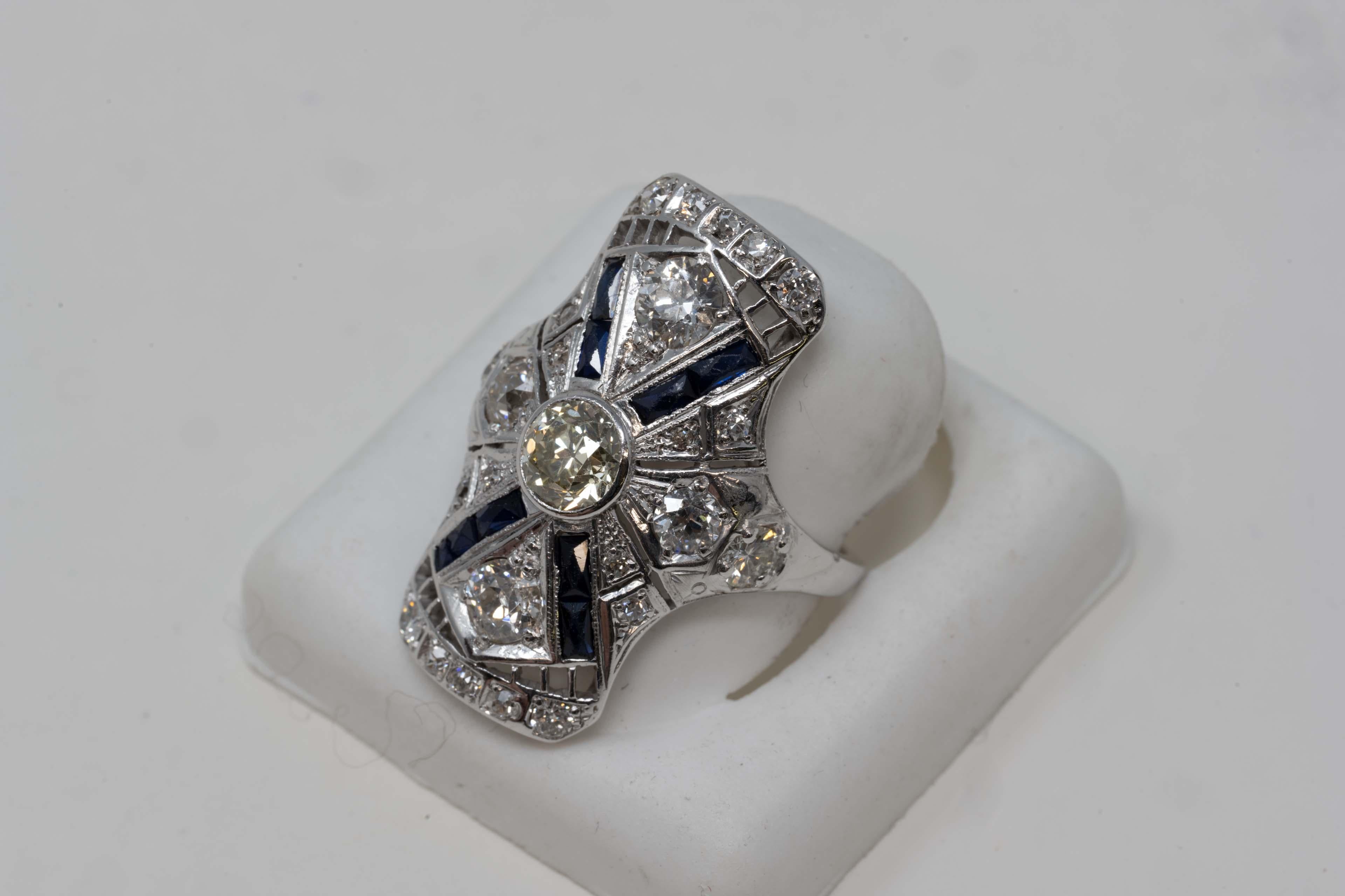 One (1) lady ring in white 14 karat gold (stamped) art deco filigree style, polished and rhodium finish. The total weight is 5.5 grams. This ring is set with one (1) old European cut diamond, the weight is .75 karat. Measurements are 5.80mm x