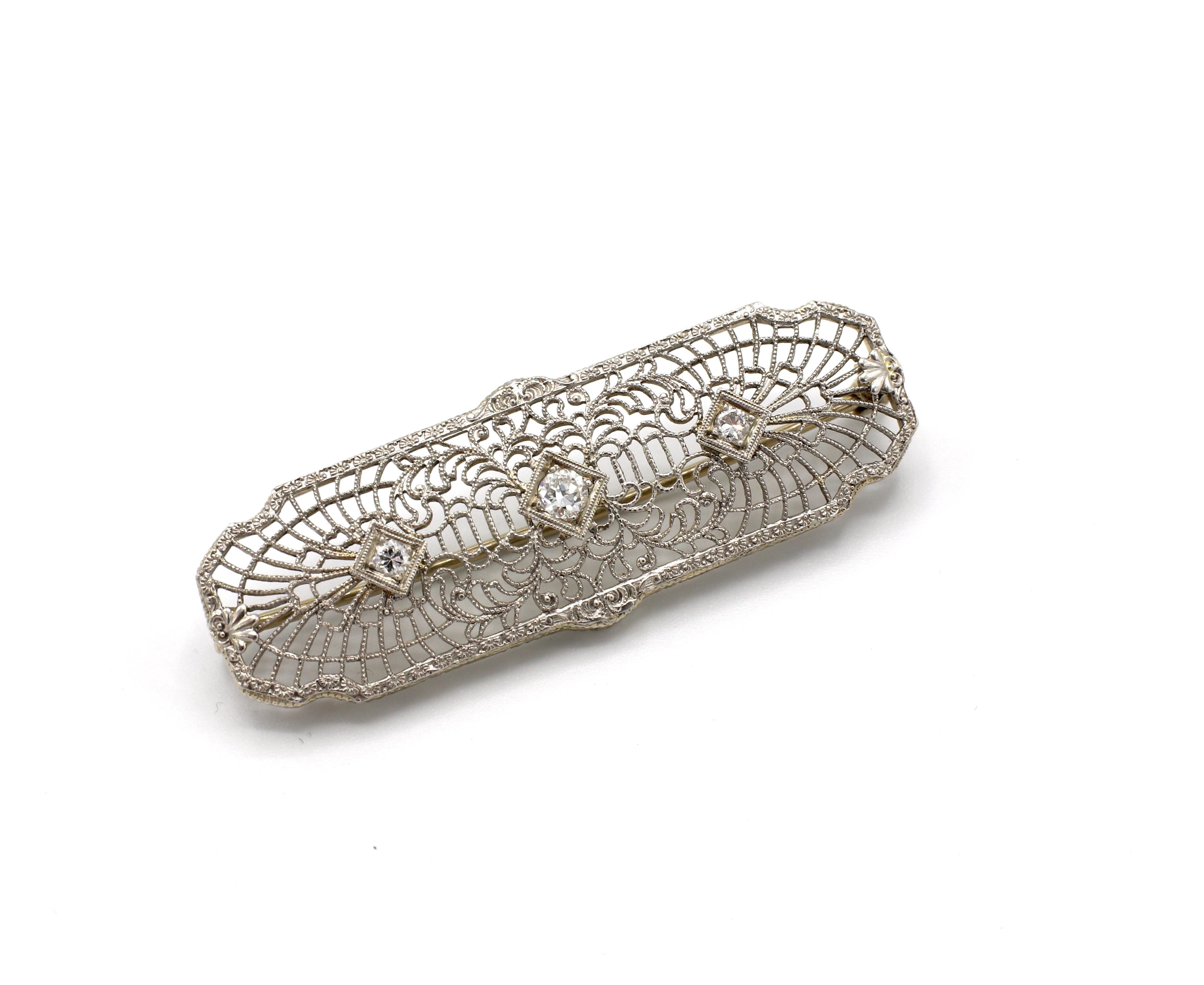 Art Deco 14K Filigree Diamond Bar Pin Brooch 

Metal: 14k gold, marked 14K
Diamonds: 3 transitional cut round diamonds, approx. .20 CTW G-H VS
Weight: 4.88 grams
Length: 1.80 inches
Width: .60 inches
