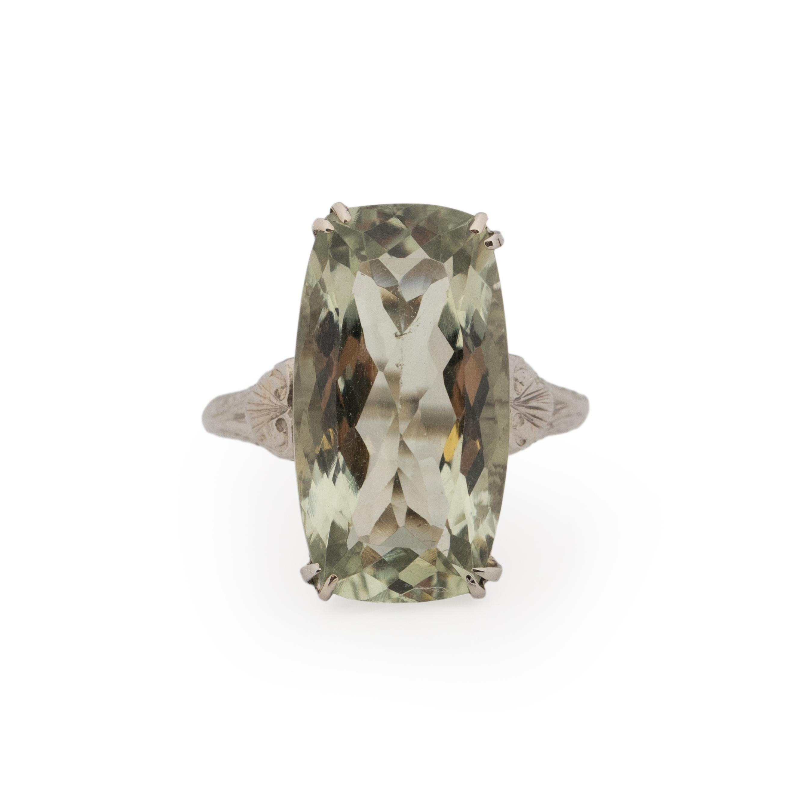 Here we have a fantastic smoking ring! This rectangle cushion cut spinel is an outstanding minty blue hue that is not something that you see every day. This minty color is breathtaking, every facet catches the light with ease drawing every eye in.