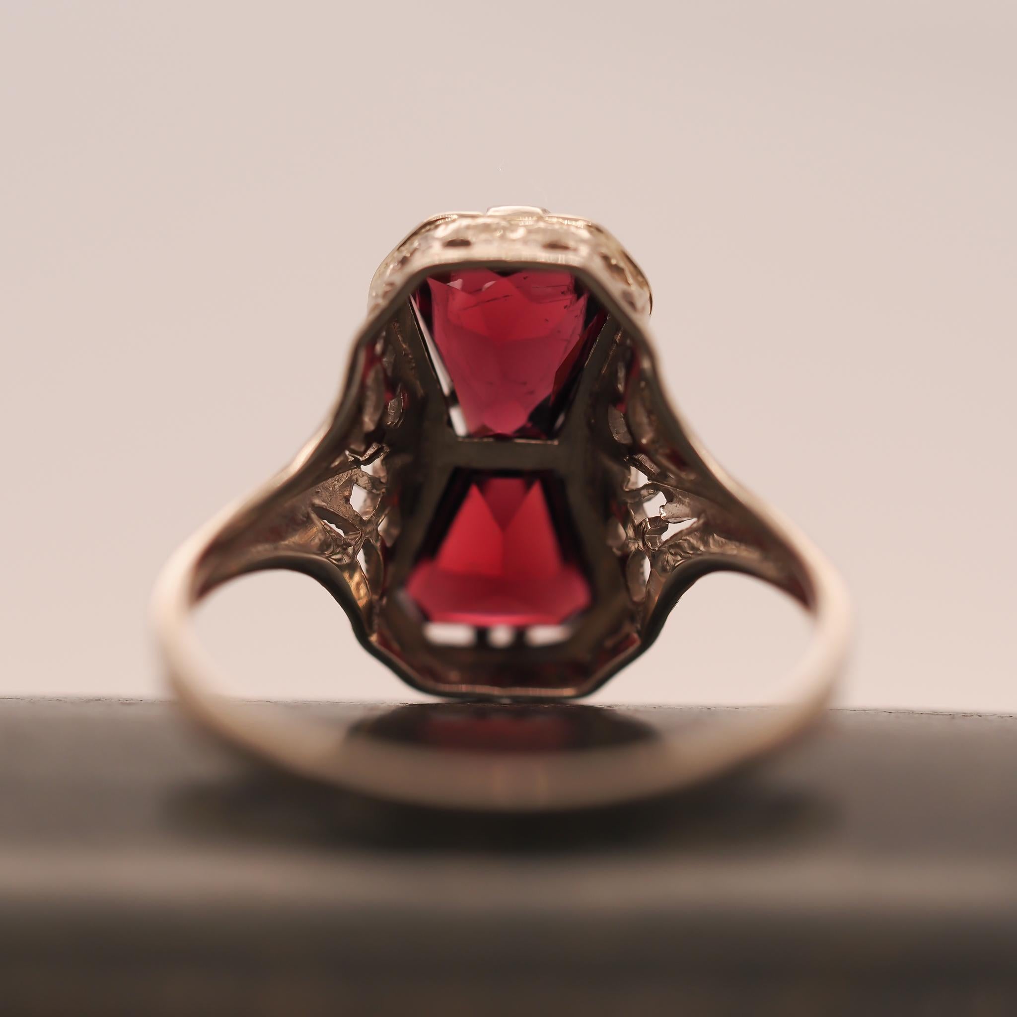 Year: 1930s

Item Details:
Ring Size: 9.75 (Sizable)
Metal Type: 14K White Gold [Hallmarked, and Tested]
Weight: 3.0 grams

Stone Details: Garnet, 1ct each, Purple color, hexagon shape.

Band Width: 1.75mm
Condition: Excellent