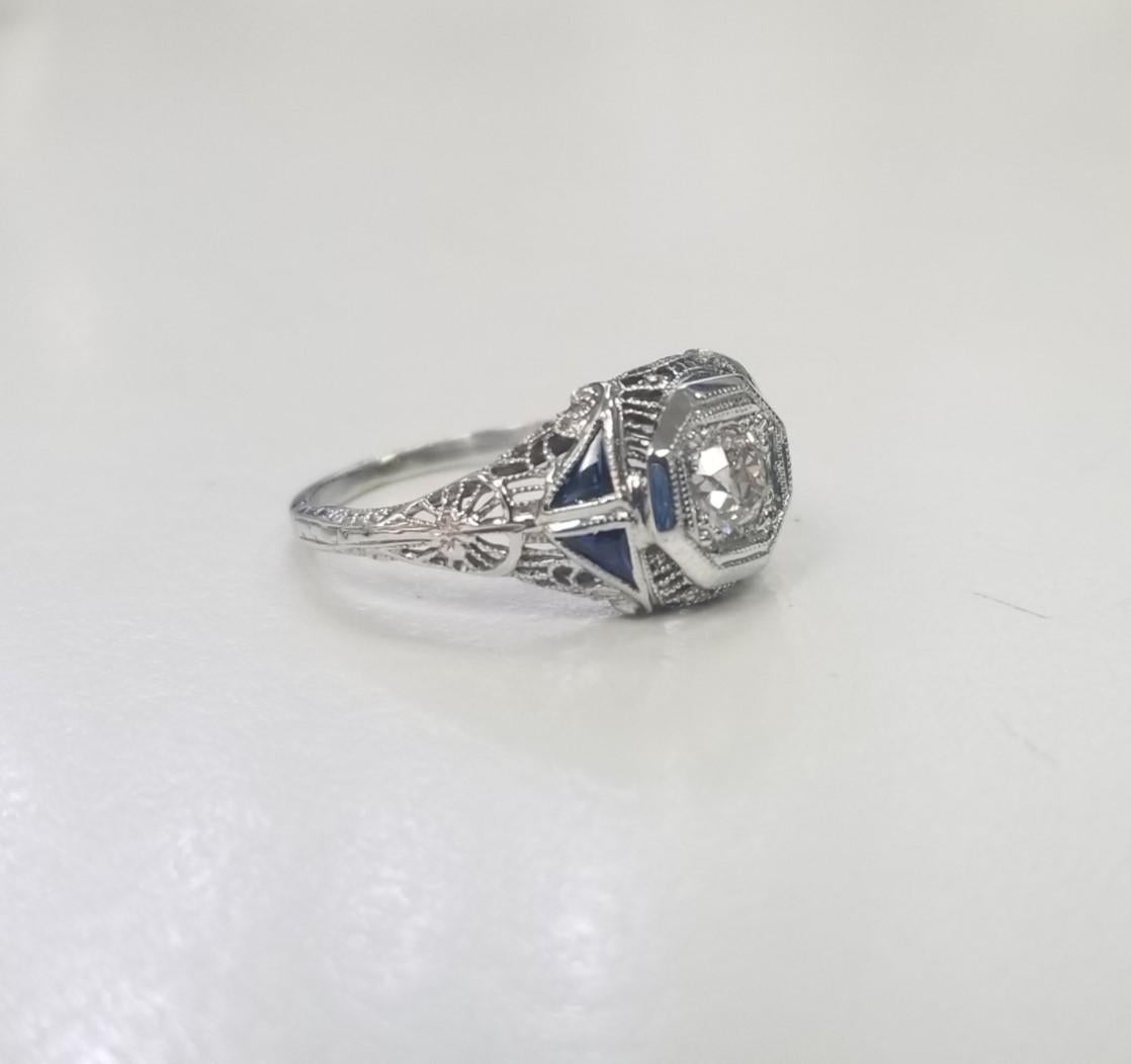 Specifications:
Pre-Owned (Great condition)
Metal: 14K Gold
Weight: 2.5 Gr
Main Stone: .39ct Old European Cut Diamond G VS2
Side stones: 4 triangle sapphires .21pts.
Size: 6.25 US






