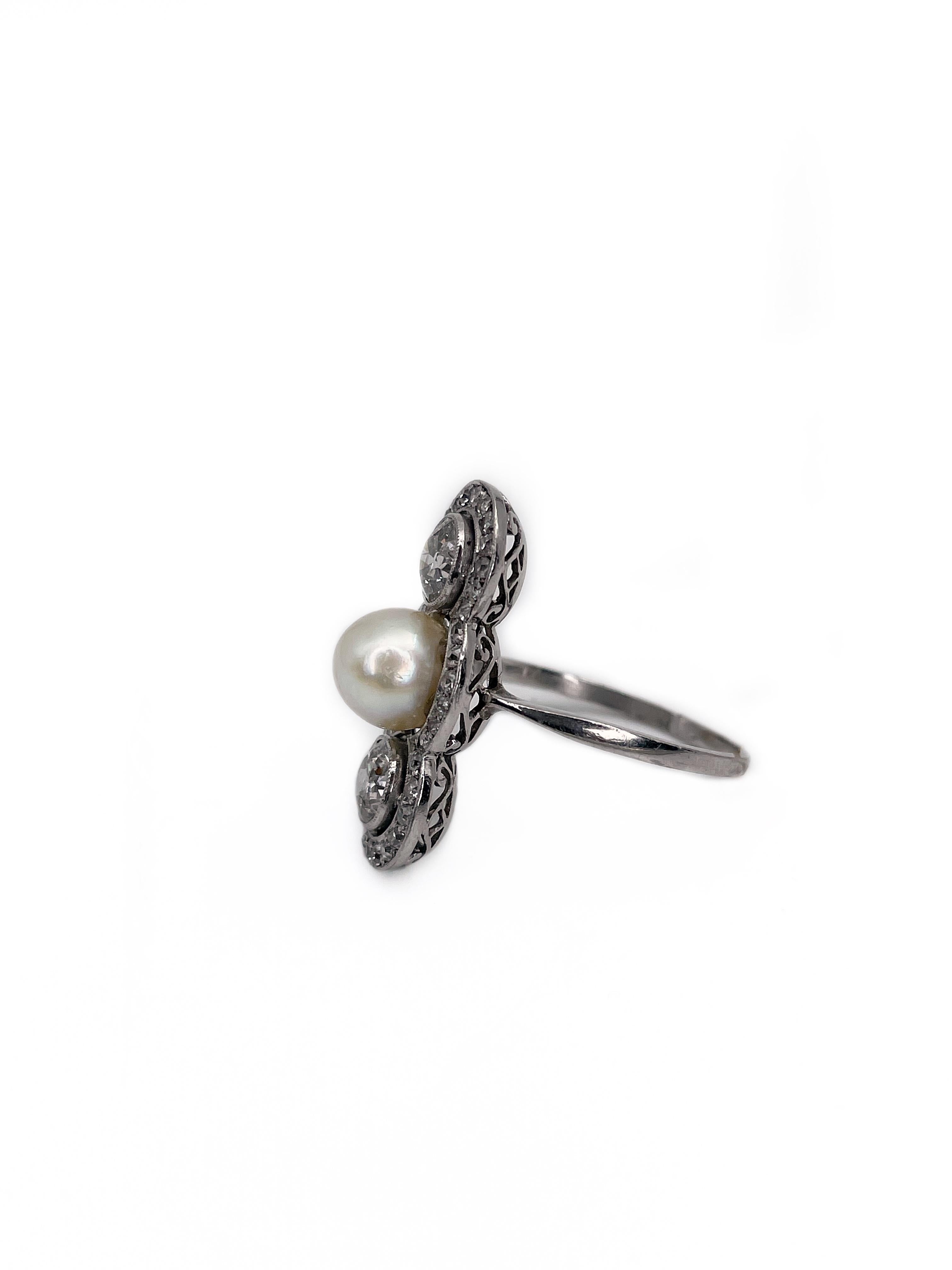 This is a magnificient Art Deco navette ring crafted in 18K white gold. The piece features cultured pearl. It is accompanied with 2 old mine cut diamonds that in total weight 0.80ct, colour - W/STW, clarity - P1. All three gems are surrounded by 38
