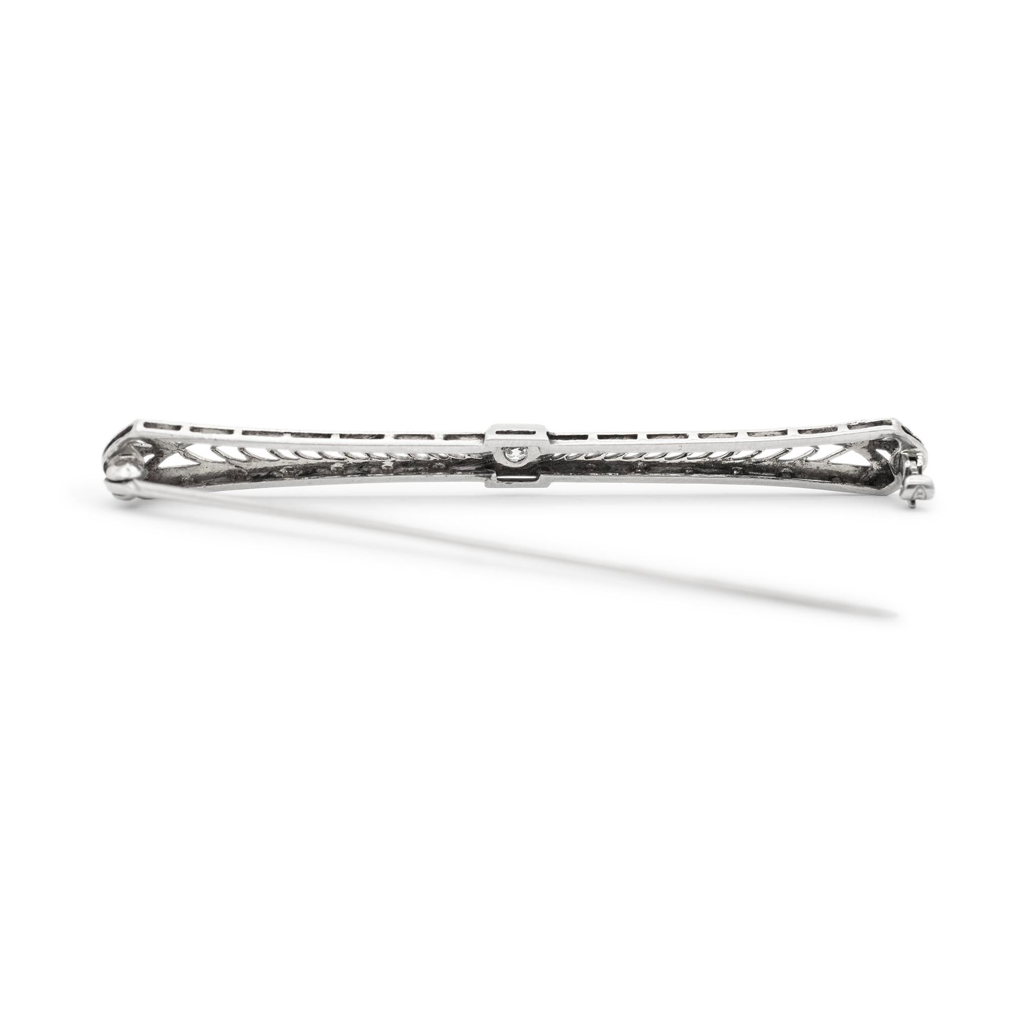 Metal Type: 14K White Gold and Platinum

Length: 2.25 inches

Width: 6.30 mm

Weight: 3.39 grams

Filigreed, 14K white gold and platinum, diamond art-deco (1920-1930) brooch. The metals were tested and determined to be 14K white gold and platinum.