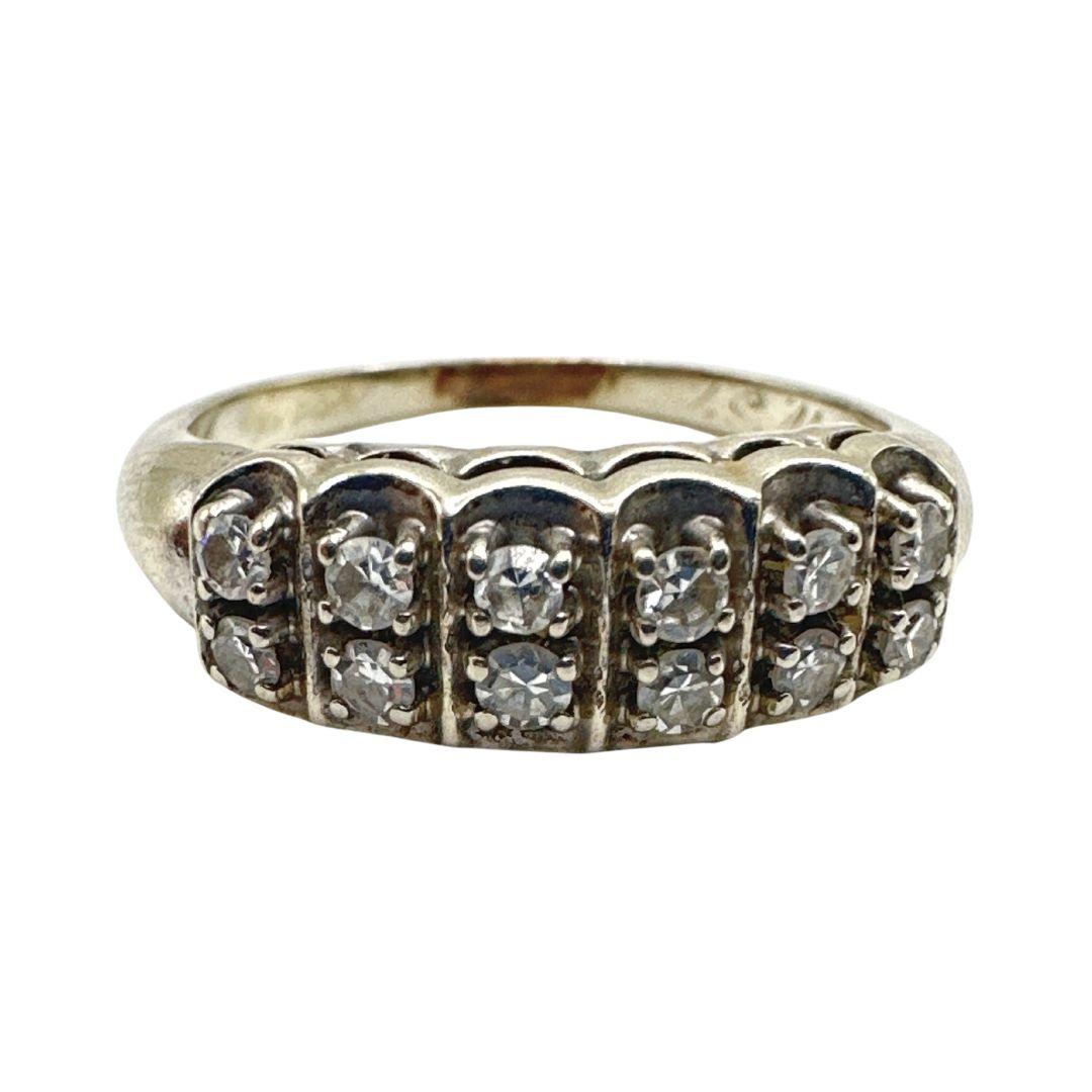 Step into the elegance and sophistication of a bygone Victorian era with this enchanting antique Art Deco ring. Immerse yourself in the intricate craftsmanship and timeless beauty of this exquisite piece, meticulously crafted with 14k white gold and