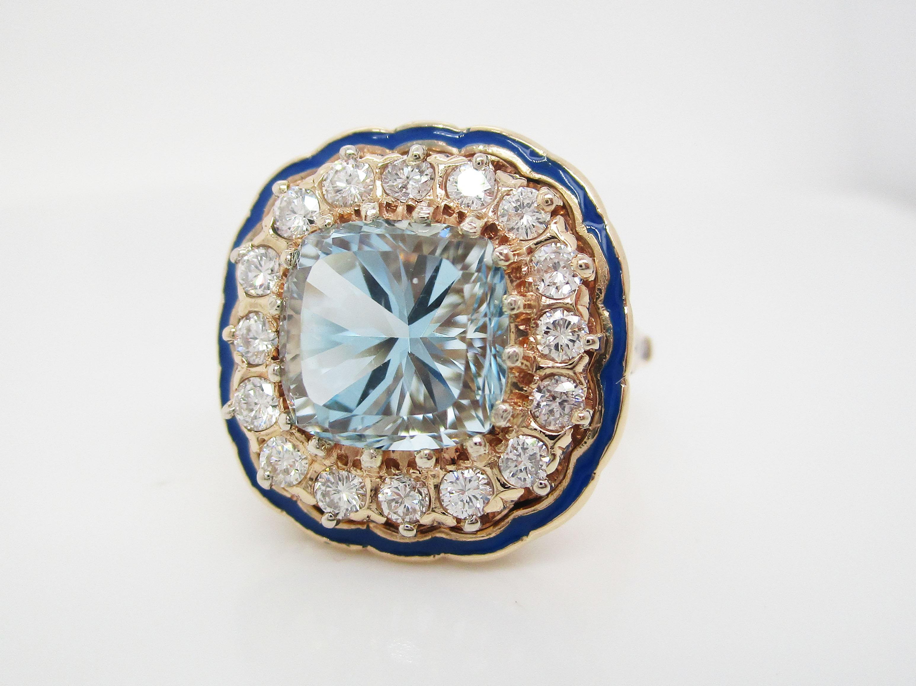 This is an absolutely gorgeous Art Deco ring in14k yellow gold with a stunning aquamarine center surrounded by a halo of diamonds and a lovely enamel frame. This beautiful ring has a square shape whose lines are indicative of Art Deco style. At the