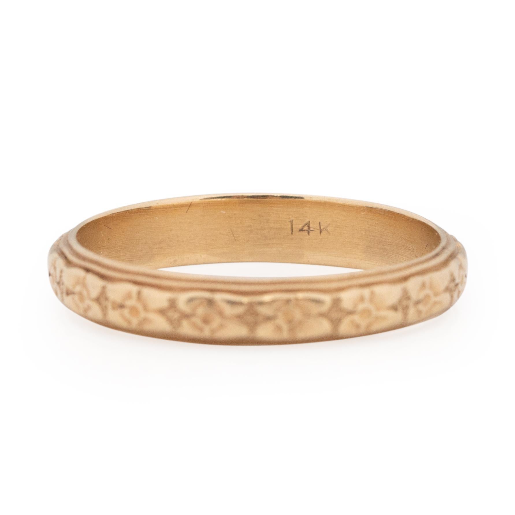 This little beauty is from the art deco era, the floral carved design is clean and shows little wear. The milgrain details along the sides are in excellent condition. This band has excellent craftsmanship, and a timeless look. Crafted in 14K yellow