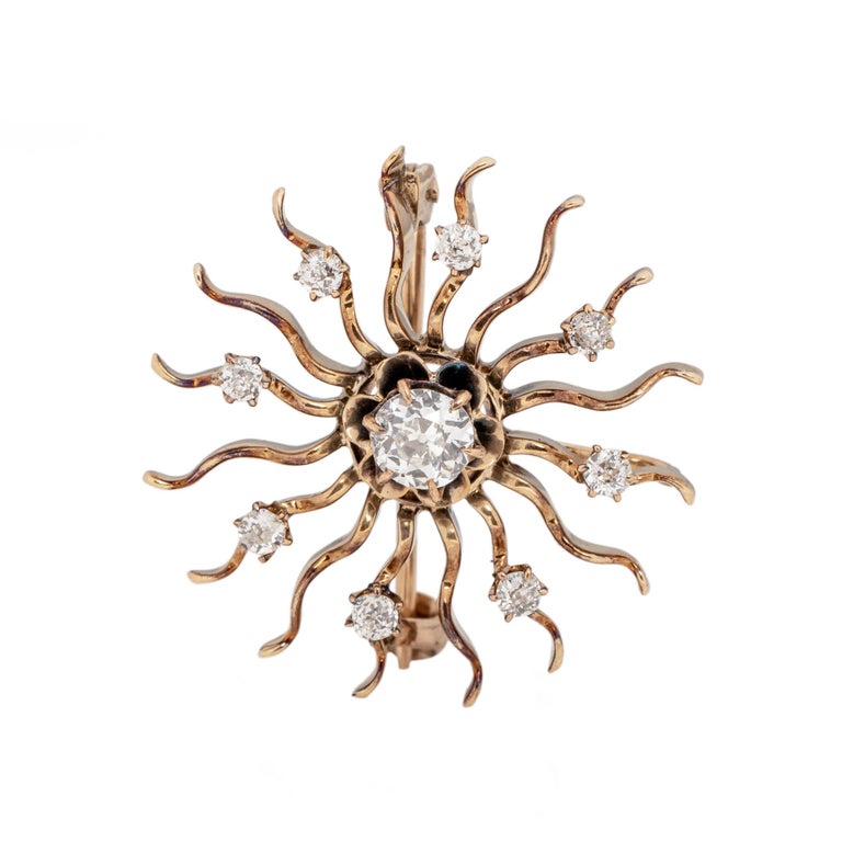 Here we have a beautiful example of an art deco convertible pin, that is a breathtaking sun design. Crafted in 14K yellow gold this pin is light weight, small in size and a great way to add a little sparkle to any outfit for any occasion. The center