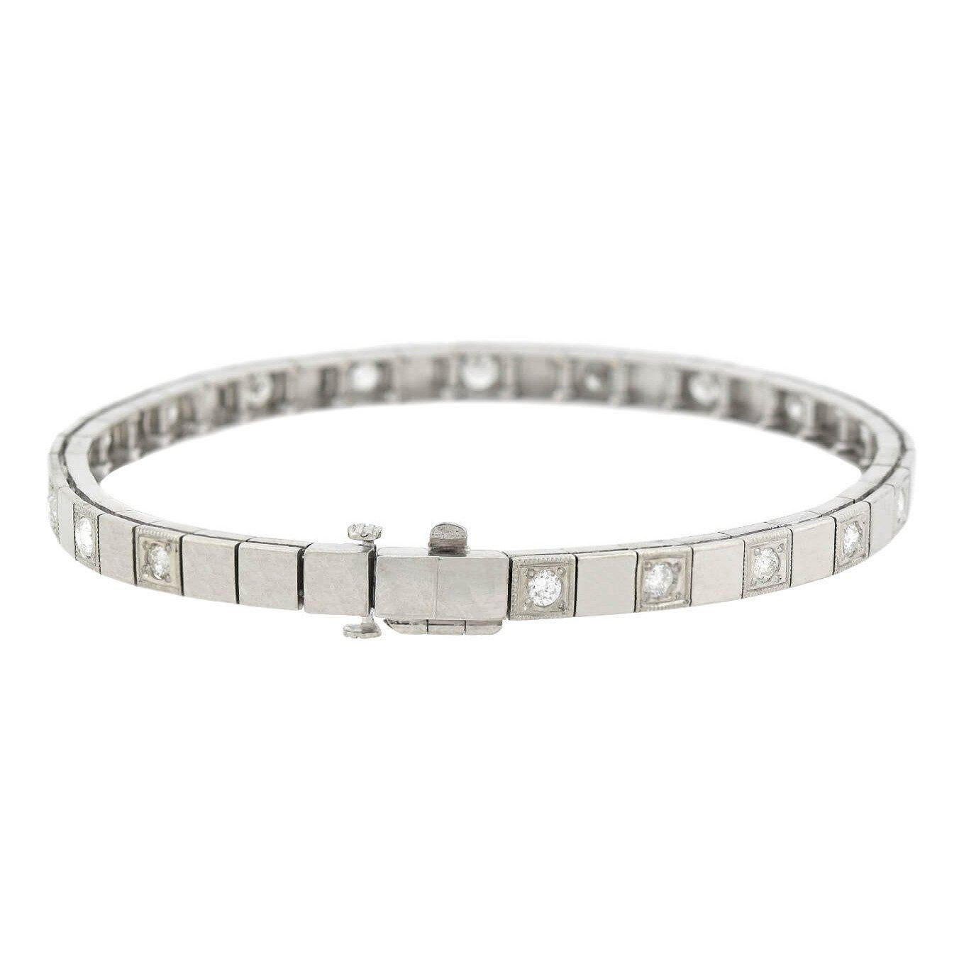 An attractive diamond link bracelet from the late Art Deco (ca1930s) era! Crafted in 14kt white gold, this unique piece consists of varying square-shaped links that alternate to form a straight but flexible design. Half of the links have a simple,