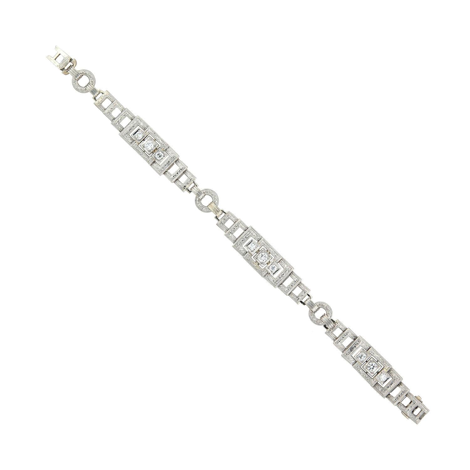 A gorgeous bracelet from the Art Deco (ca1920s) era! Crafted in 14kt yellow gold and topped in platinum, this bracelet has a wonderful geometric appeal. The bracelet is formed by hinged links to create a layered square effect connected by round