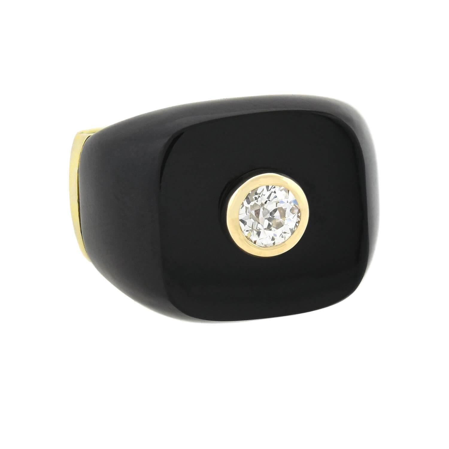 A bold and unusual onyx ring from the Art Deco (ca1920s) era! This stylish ring is crafted in vibrant 14kt yellow gold and is particularly substantial in both size and appearance. The ring has a square-shaped onyx face, which is flat on the surface