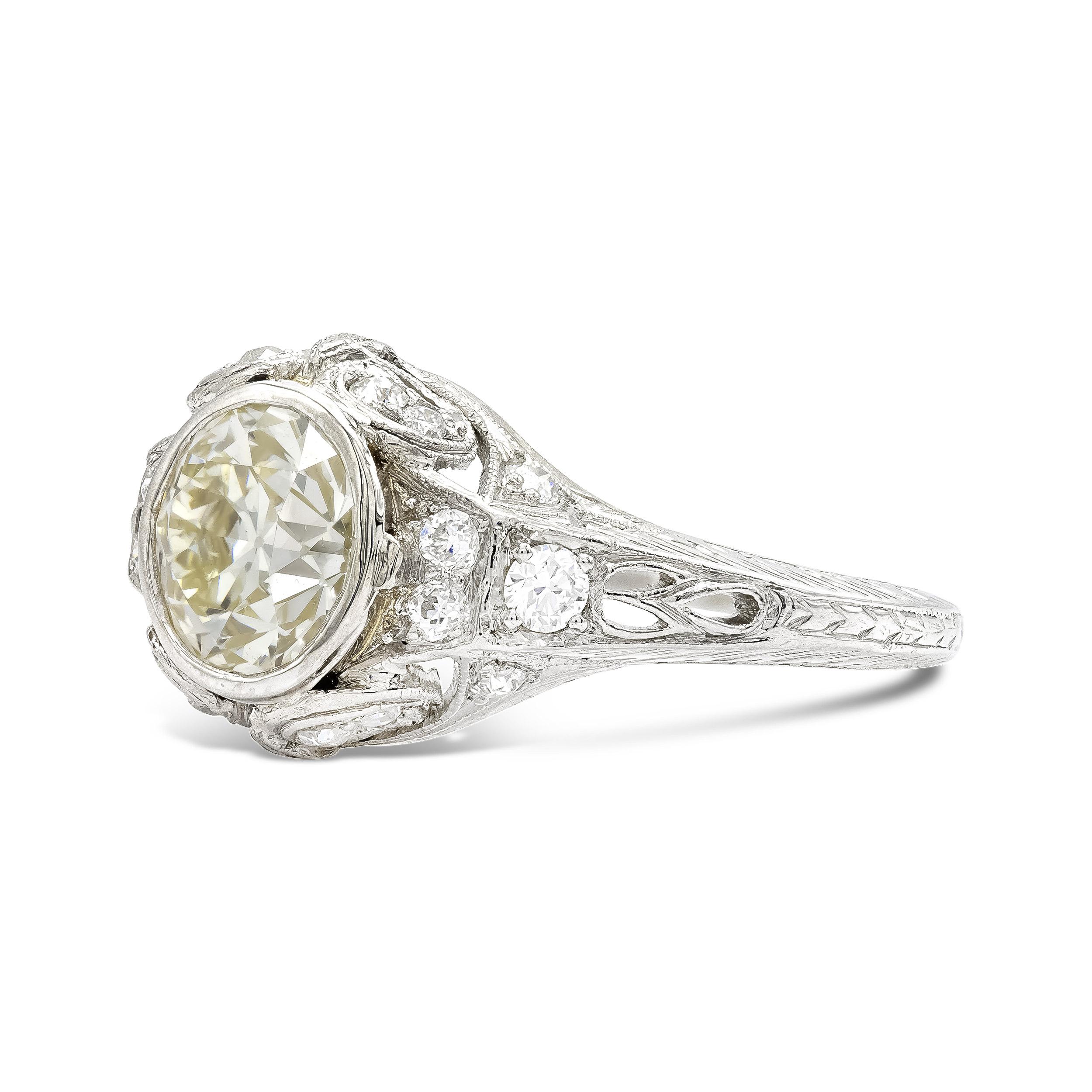 There is so much to love about this bold deco beauty. Centering the ring is a bezel-set old Euro that sparkles until tomorrow. At 1.50 carats, she is a vintage vision, boasting a beautiful facet pattern. Delicate hand-carved details complete the