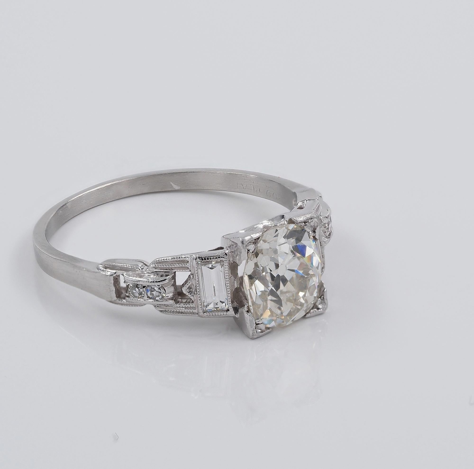 Roaring 20’s
This beautiful Art deco Diamond solitaire ring has been hand crafted of solid Platinum during 1920 ca, tested
Appealing mounting displaying unique design from the period with gorgeous openwork and buckle design connecting the crown to