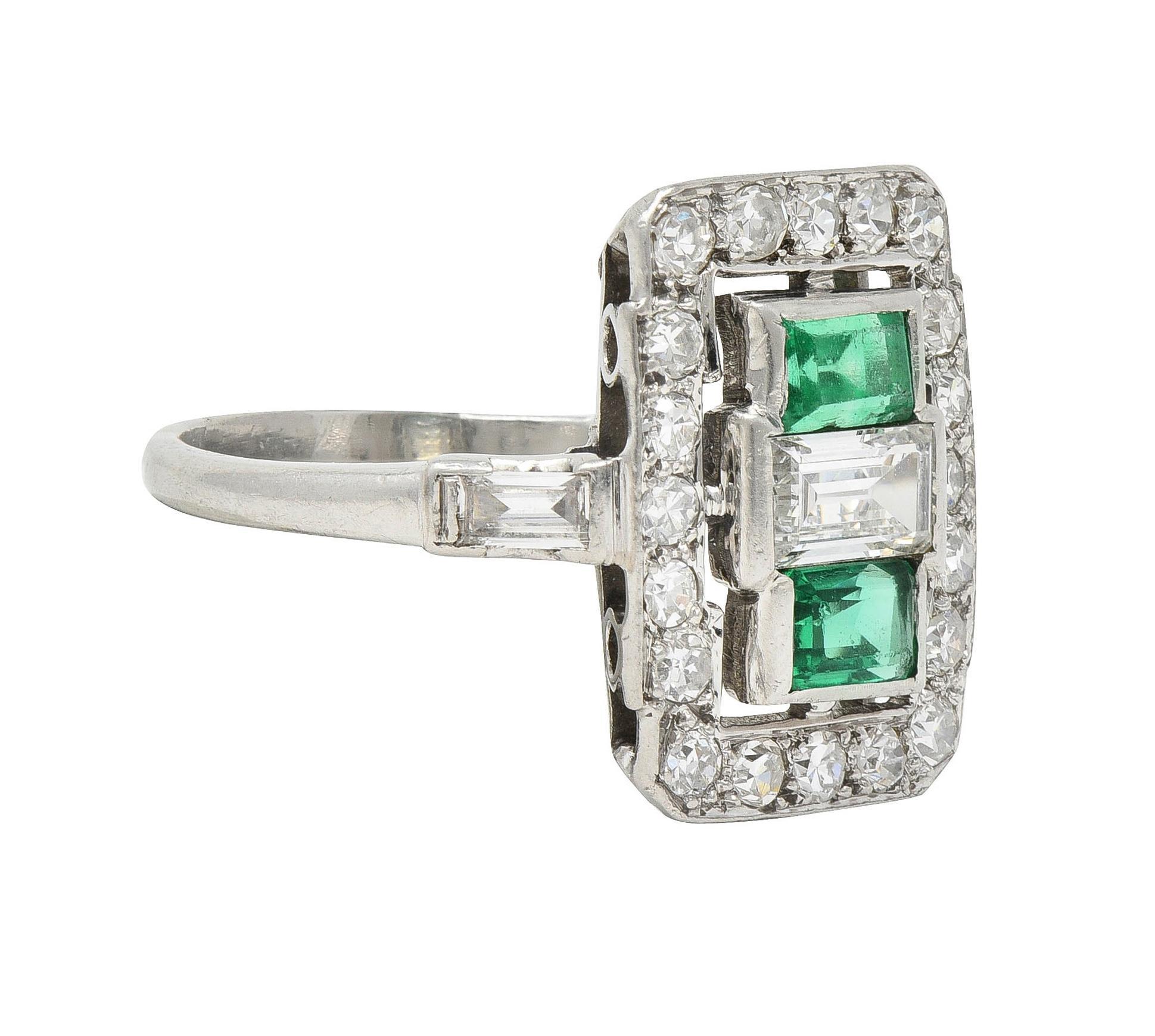 Designed as a rectangular form centering a baguette cut diamond weighing approximately 0.30 carat
G color with VS2 clarity - bar set and flanked north to south by emerald cut emeralds
Weighing approximately 0.55 carat total - transparent medium