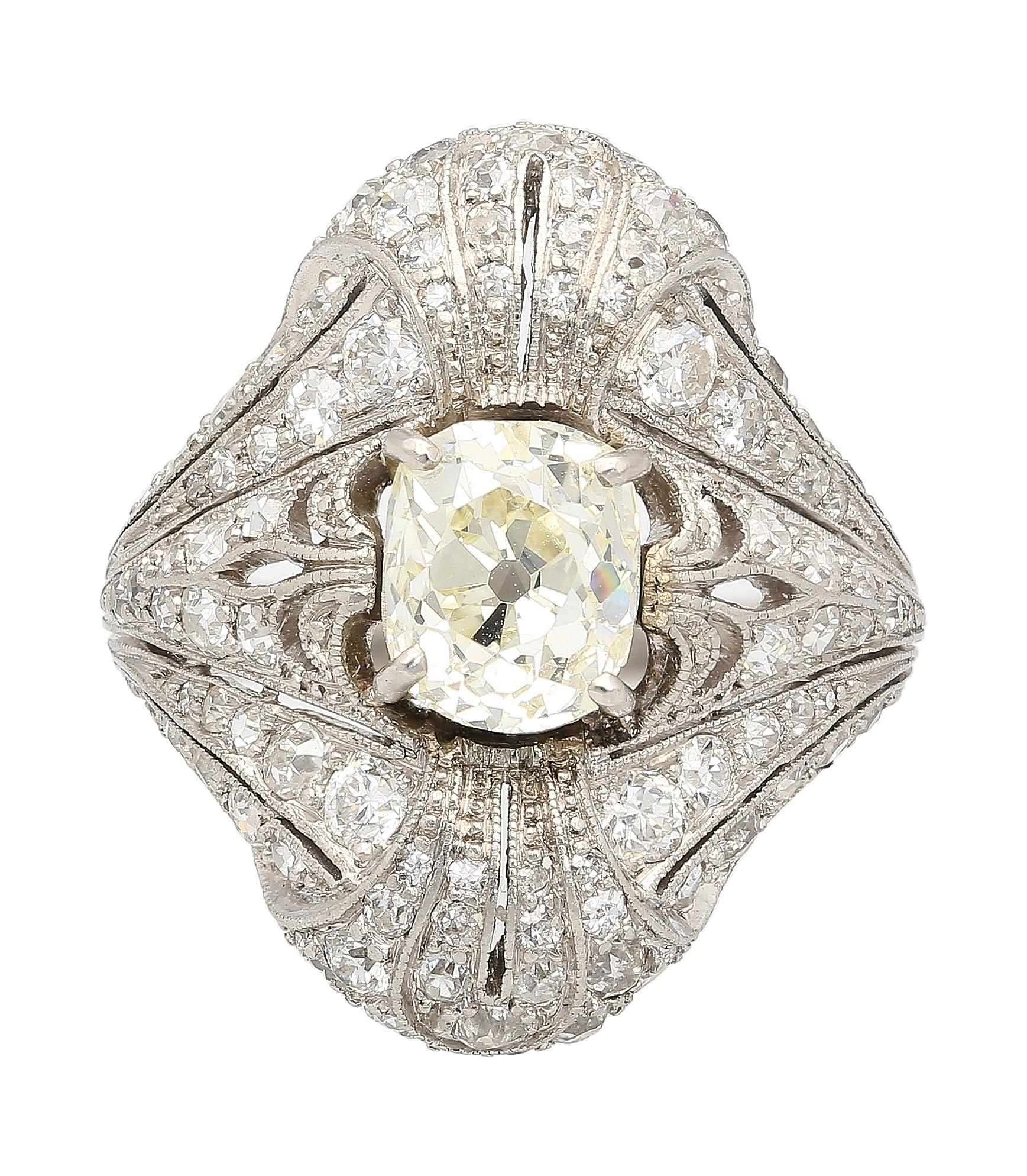 Original Art Deco old cut diamond ring in platinum. Long vertical frame with a dome-shape shank that gives excellent coverage on the finger. Precise filigree and milgrain workmanship with 98 diamond pointers throughout the setting. This ring, in its